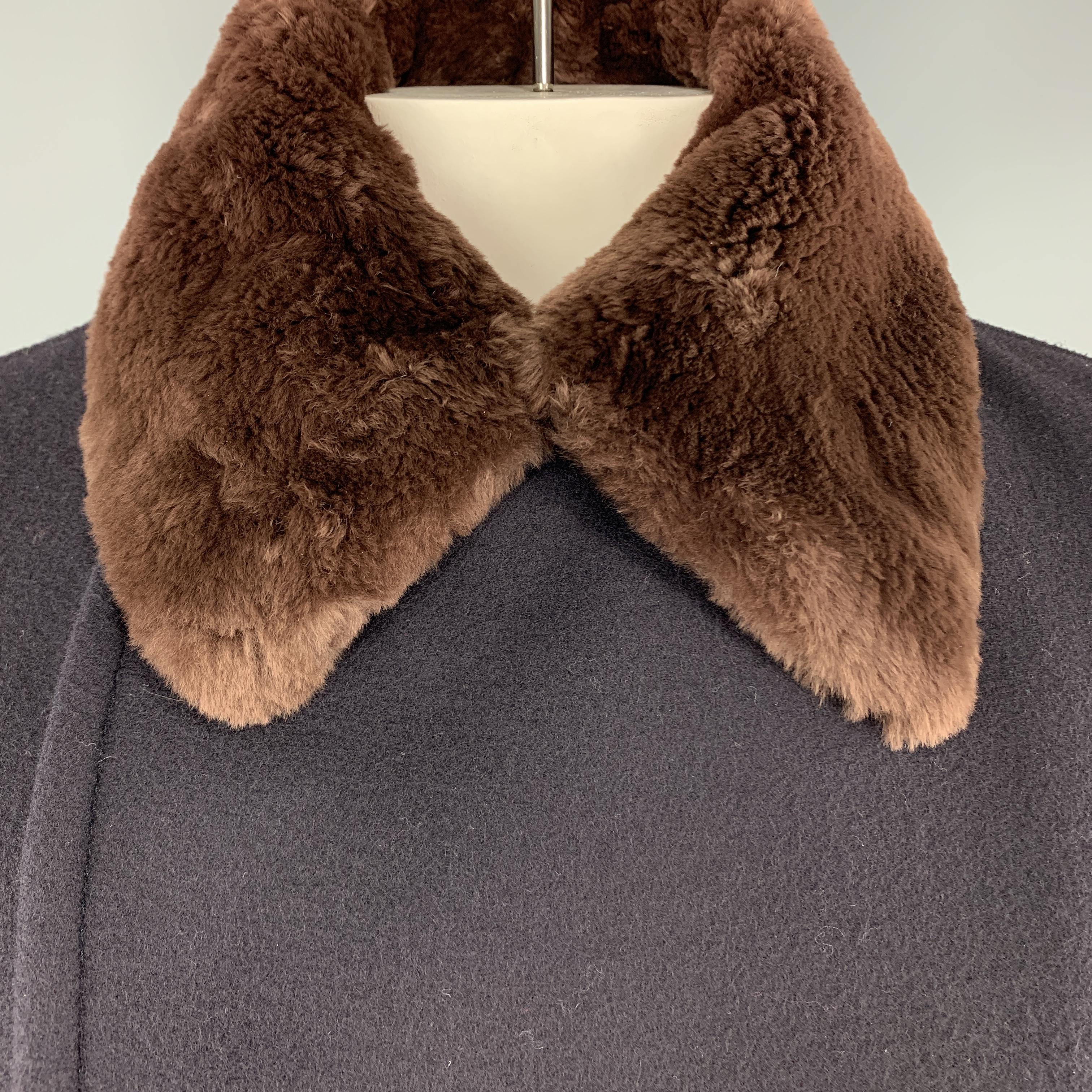 PRADA pea coat comes in navy wool with a double breasted button front, slanted pockets, and detachable brown nutria fur collar. Made in Italy.

Excellent Pre-Owned Condition.
Marked: IT 56

Measurements:

Shoulder: 19 in.
Chest: 48 in.
Sleeve: 26.5