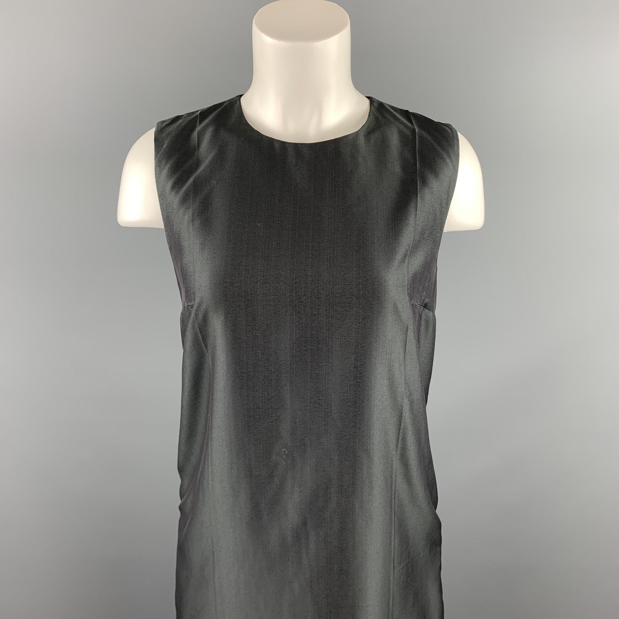 PRADA sleeveless dress comes in a gray silk featuring a shift style and a back zip up closure. Made in Italy.

Very Good Pre-Owned Condition.
Marked: 6

Measurements:

Shoulder: 13.5 in.
Bust: 34 in. 
Hip: 36 in.
Length: 34.5 in. 

