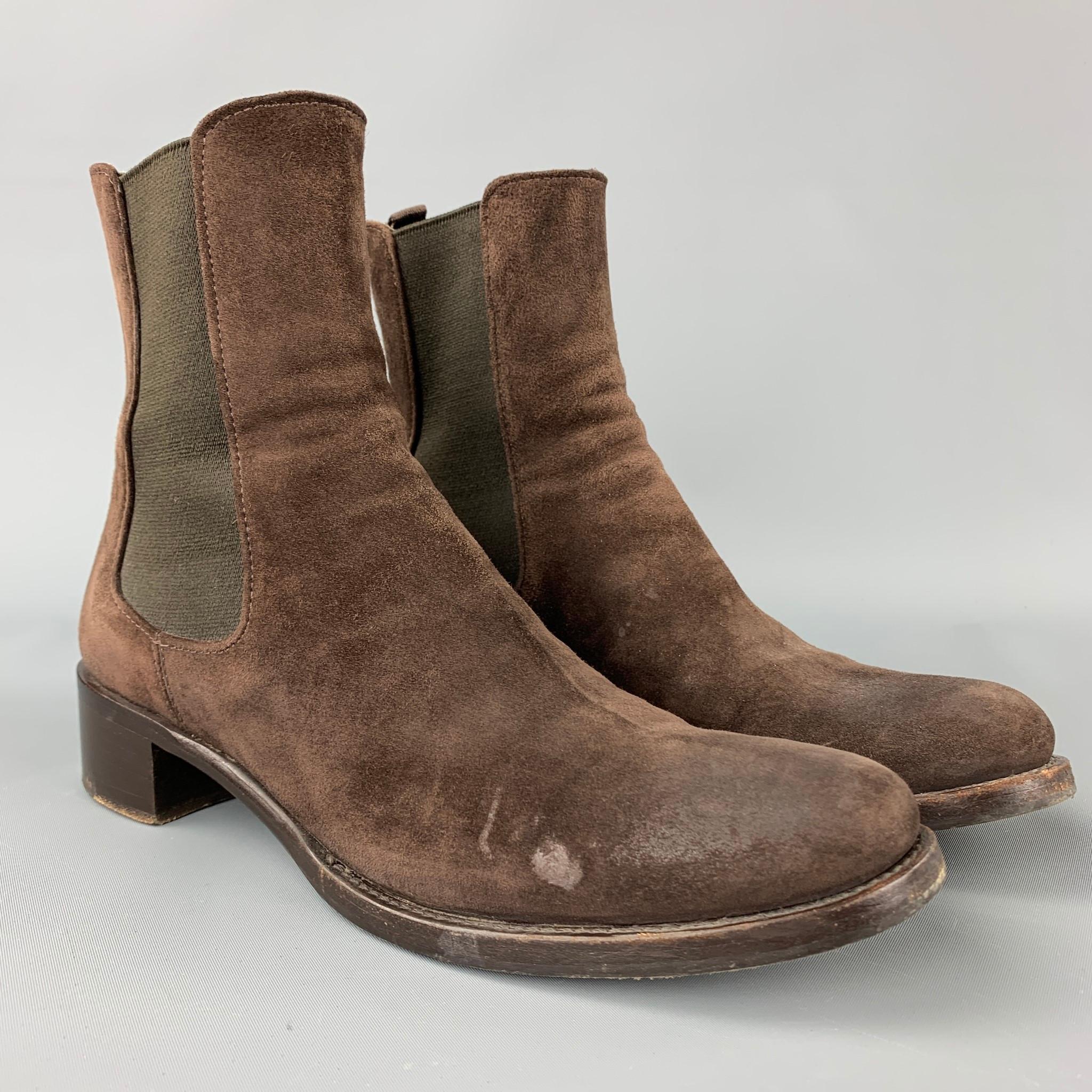 PRADA boots comes in a brown suede featuring a chelsea style, slip on, and a chunky heel. Moderate wear. Made in Italy.

Good Pre-Owned Condition.
Marked: EU 36.5
Original Retail Price: $950.00

Measurements:

Length: 10.5 in.
Width: 3.5 in.
Height: