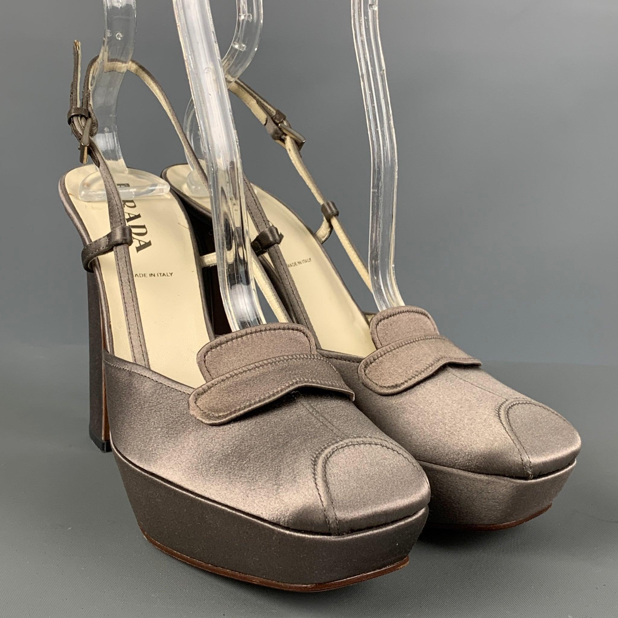 PRADA heel come in grey woven satin material with a sling back, and platform chunky heels. Made in Italy.Very Good Pre-Owned Condition. As Is. 

Marked:   36 1/2Heel: 5 inches Platform: 1 inches 

  
  
 
Reference: 124369
Category: Pumps
More