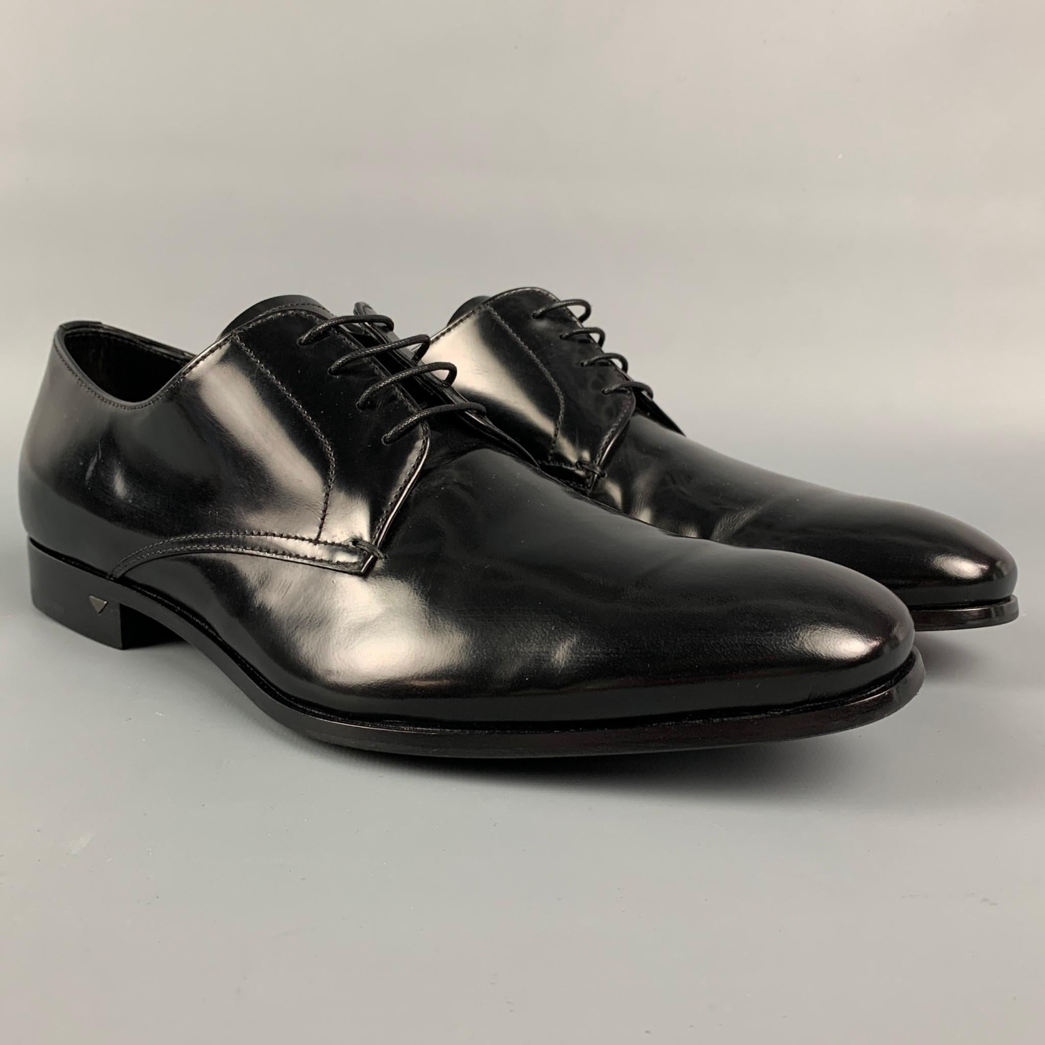 PRADA shoes comes in a black patent leather featuring a square toe, stacked heel, and a lace up closure. Made in Italy.

New without tags. 
Marked: 2 EB 106 6

Outsole: 11 in. x 3.5 in. 