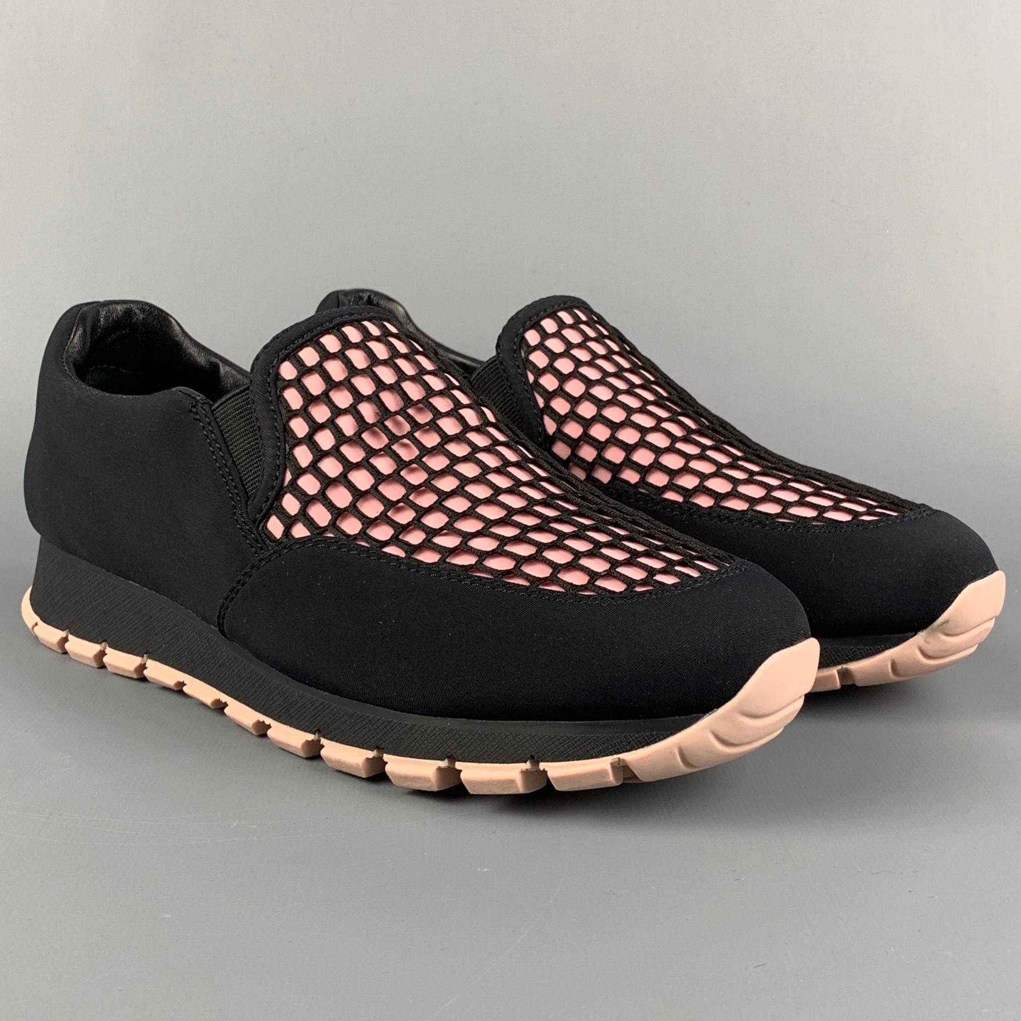PRADA sneakers comes in a black & pink nylon featuring a mesh design, slip on, and a rubber sole. 

New With Box.
Marked: 3S 6140 37.5

Outsole: 11 in. x 3.5 in. 