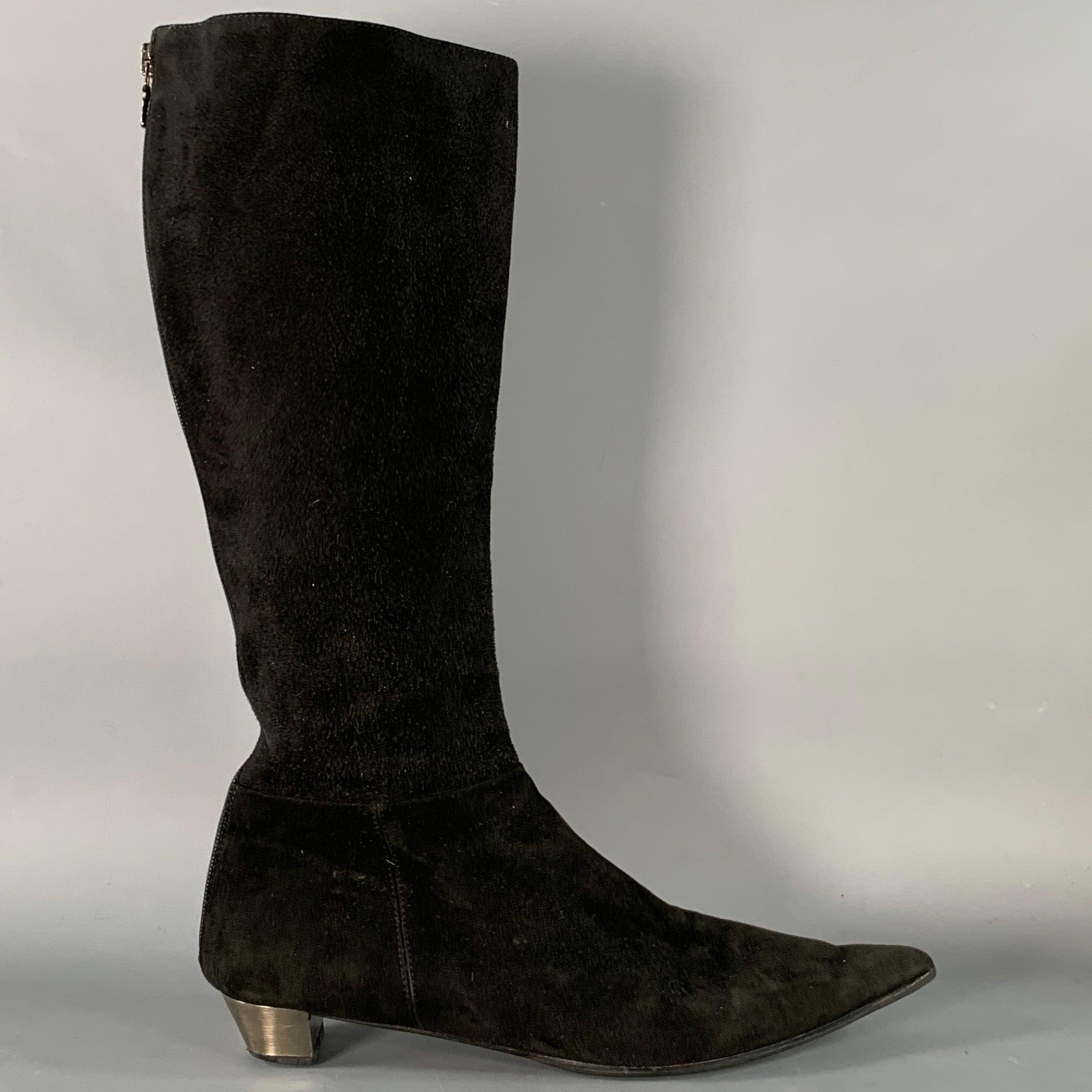PRADA boots
in a black suede featuring a calf high style, silver tone metal heel detail, and back zipper closure. Made in Italy.Very Good Pre-Owned Condition. 

Marked:   3231 37.5 

Measurements: 
  Length: 10.75 inches Width: 3 inches Height (with