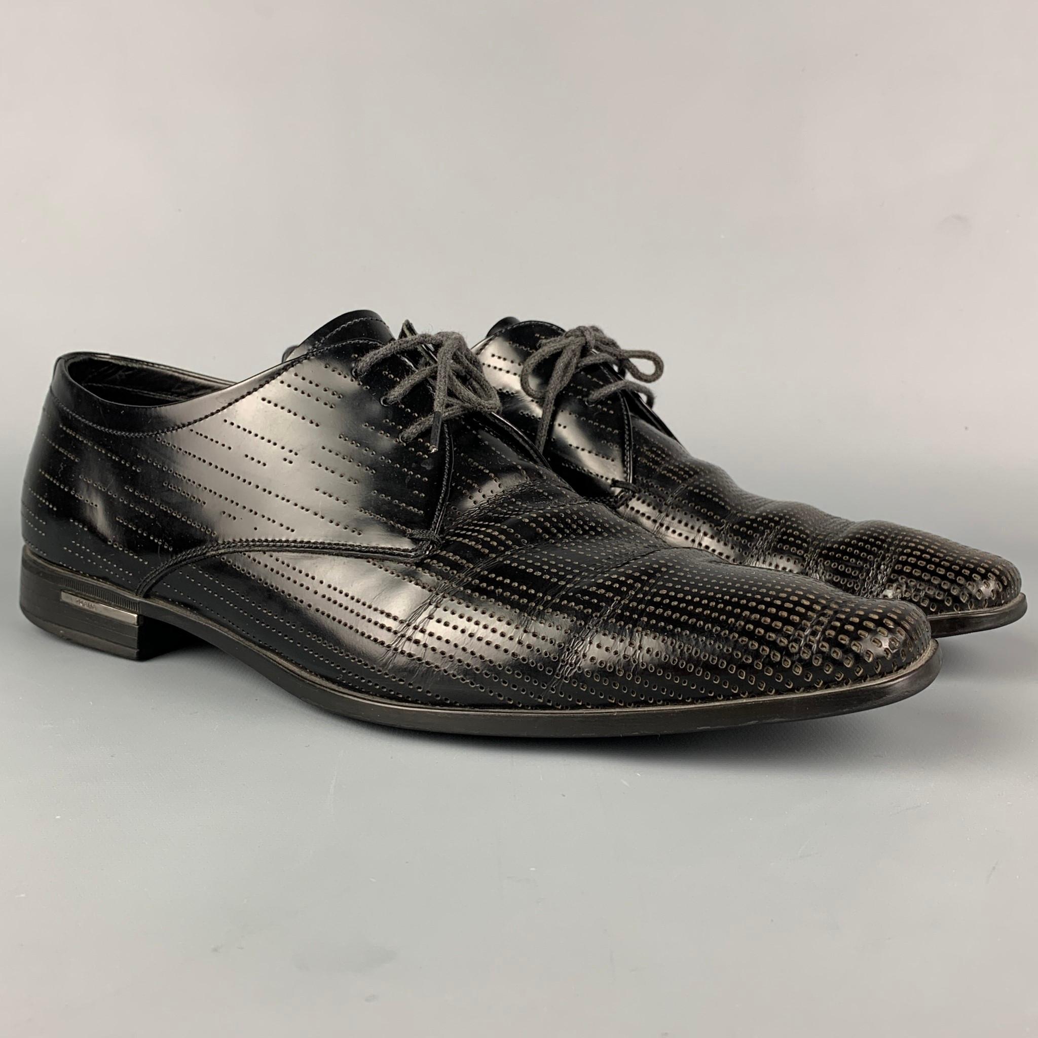 PRADA shoes comes in a black perforated leather featuring a square toe and a lace up closure. Made in Italy. 

Good Pre-Owned Condition. Light wear.
Marked: 2EE 044 8

Outsole: 12 in. x 4 in. 
