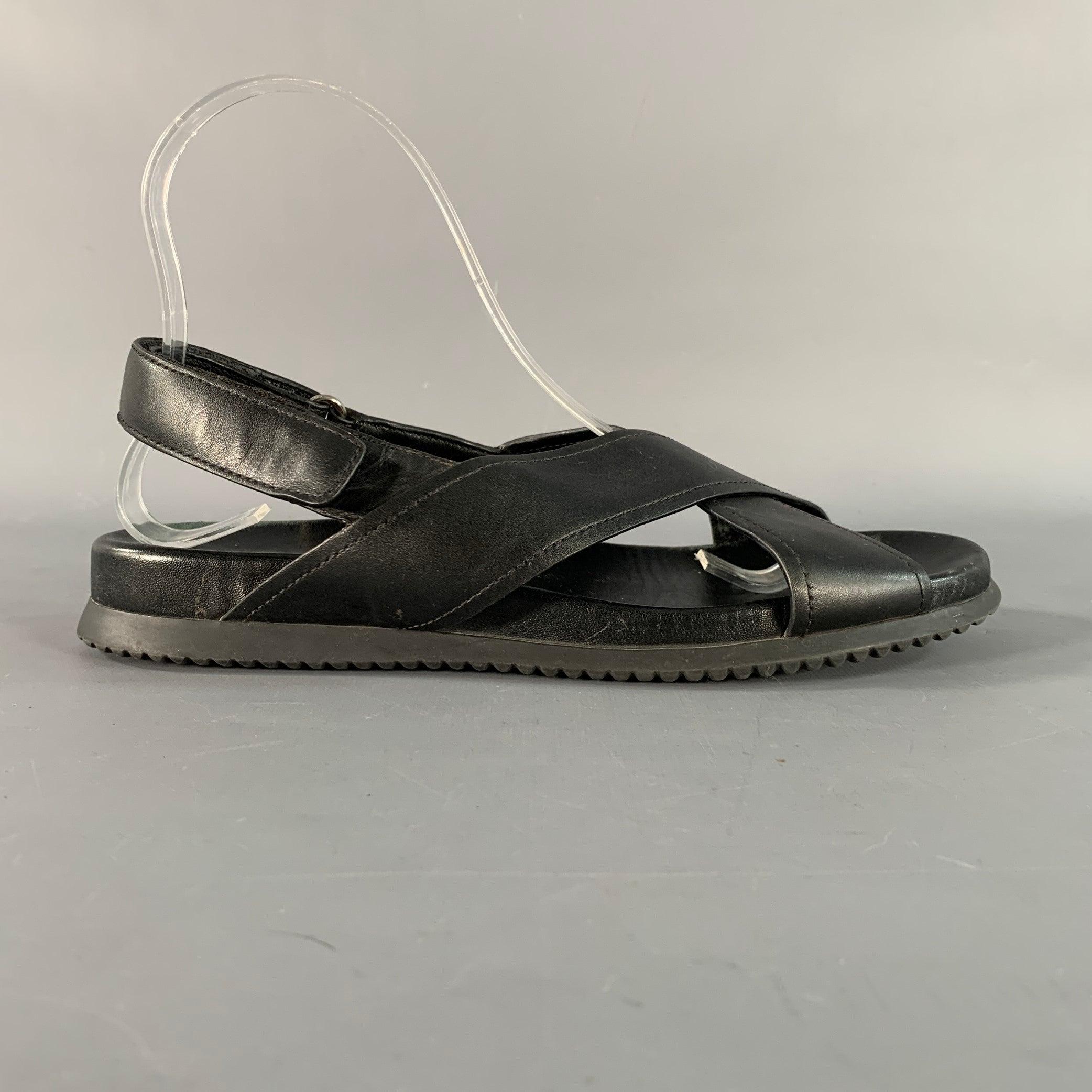 PRADA sandals in a black leather featuring a strappy design, and velcro closure.Very Good Pre-Owned Condition. 

Marked:   3X6002 38Outsole:10.25 inches  x 4 inches  
  
  
 
Sui Generis Reference: 139764
Category: Sandals
More Details
    
Brand: 