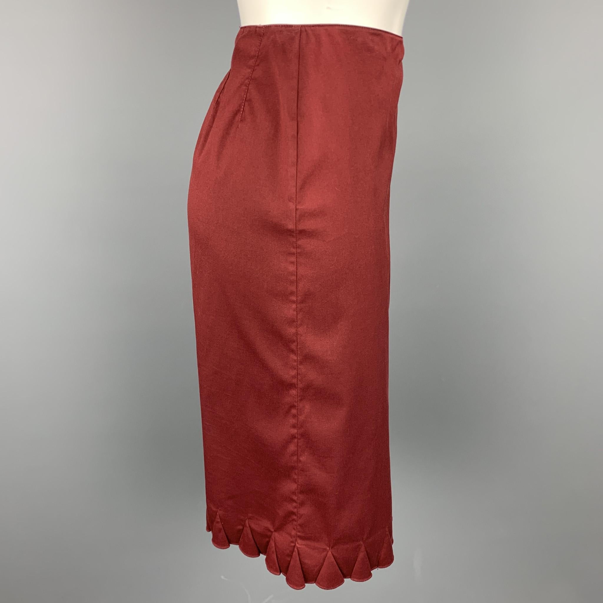 PRADA skirt comes in a burgundy cotton blend with no liner featuring a a-line style, ruffled hem, and a side zip up closure. Made in Italy.

Excellent Pre-Owned Condition.
Marked: 42

Measurements:

Waist: 28 in. 
Hip: 34 in.
Length: 23 in. 

SKU: