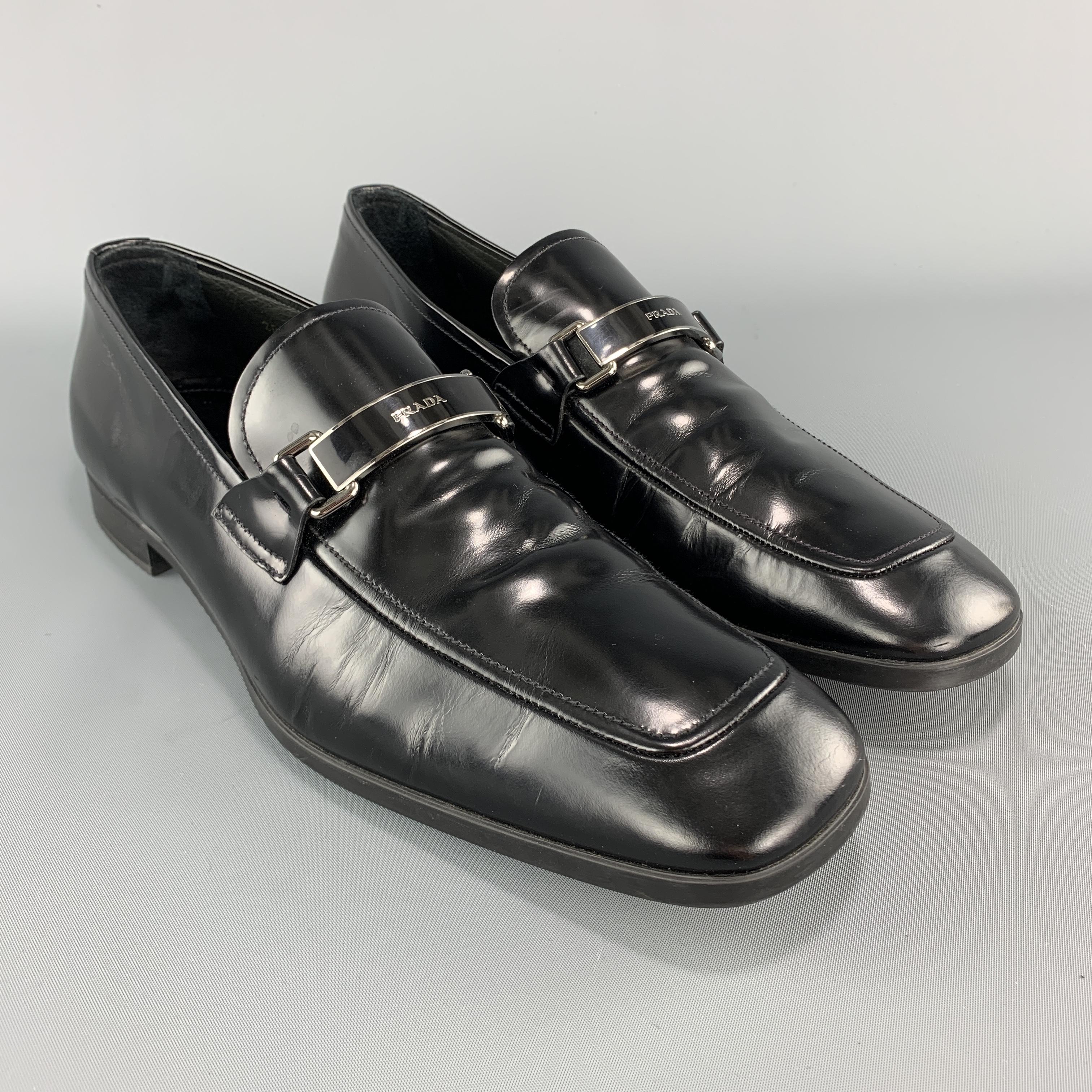 PRADA loafers come in black patent leather with an apron toe, rubber sole, and black enamel logo strap. Wear throughout. With box. 

Good Pre-Owned Condition.
Marked: UK 9

Outsole: 12 x 4 in.