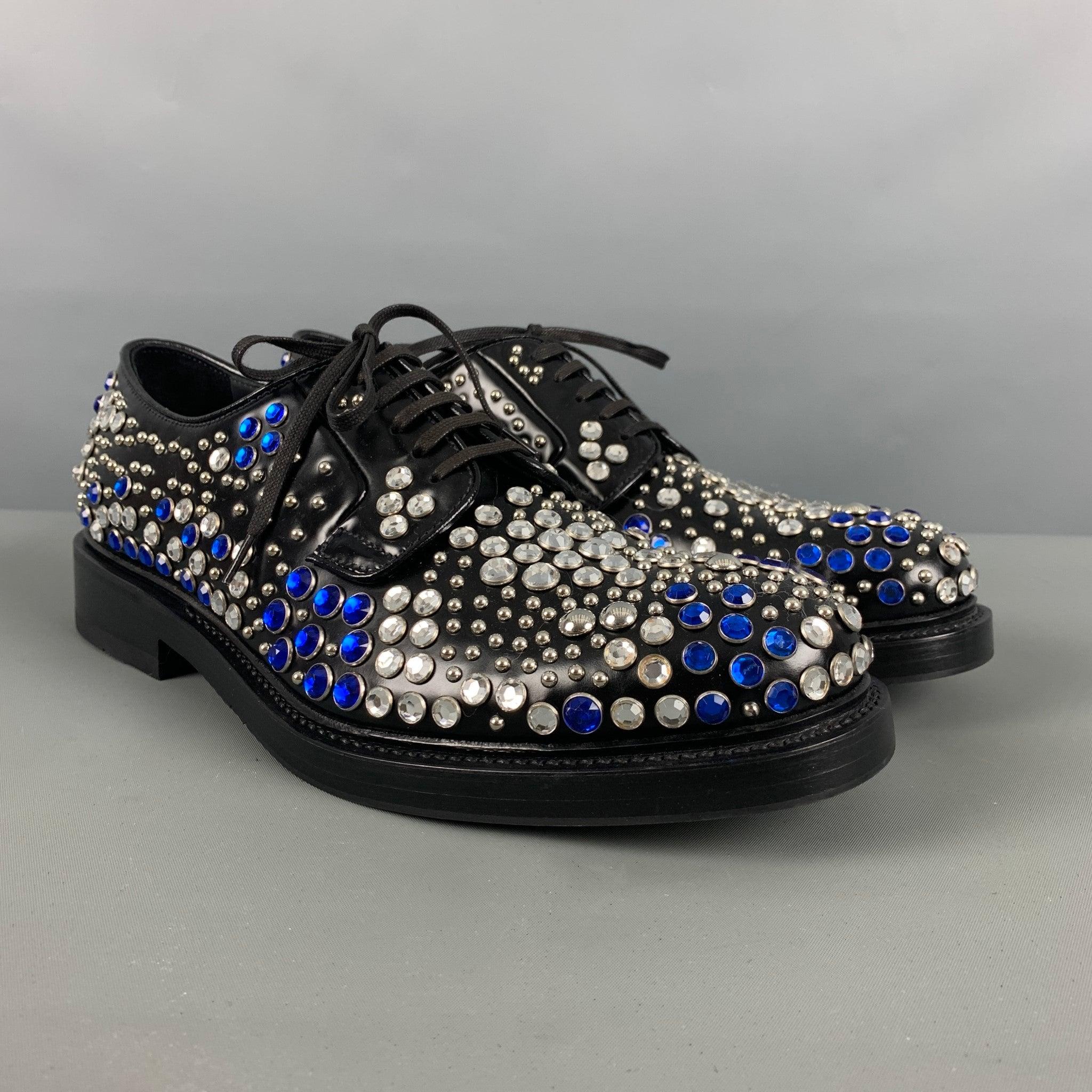 PRADA shoes comes in a black leather featuring a blue and silver tone studded design throughout, round
 toe, wooden sole, and a lace up closure. Comes with Box and Dusty Bag. Made in Italy.Excellent Pre-Owned Condition. 

Marked:   2EA151 8Outsole:
