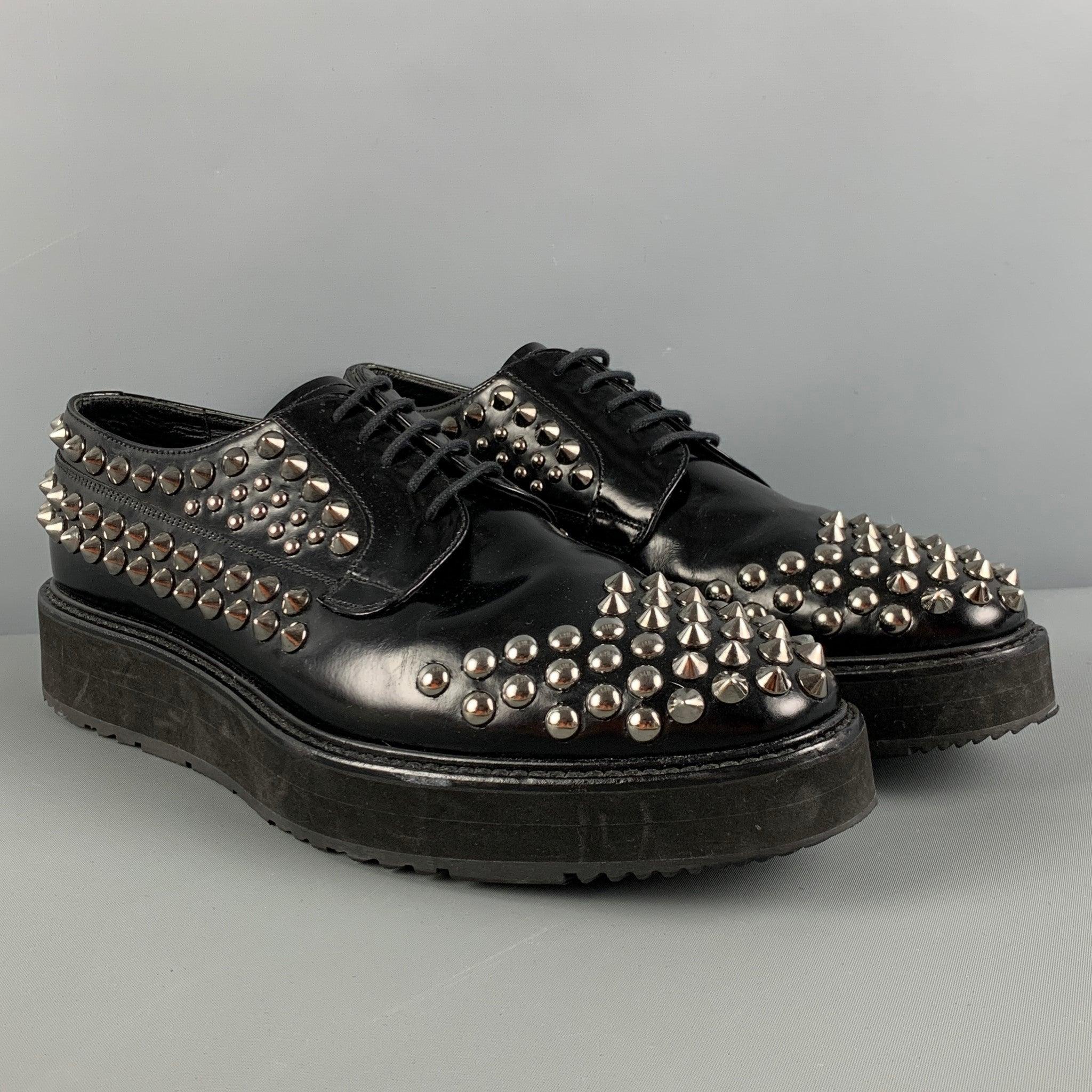 PRADA shoes comes in a black leather featuring a studded design throughout, square toe, rubber sole, and a lace up closure. Made in Italy.Very Good
Pre-Owned Condition. 

Marked:   9 2EG 080 8Outsole: 12.5 inches  x 4.25 inches 
  
  
 
Reference: