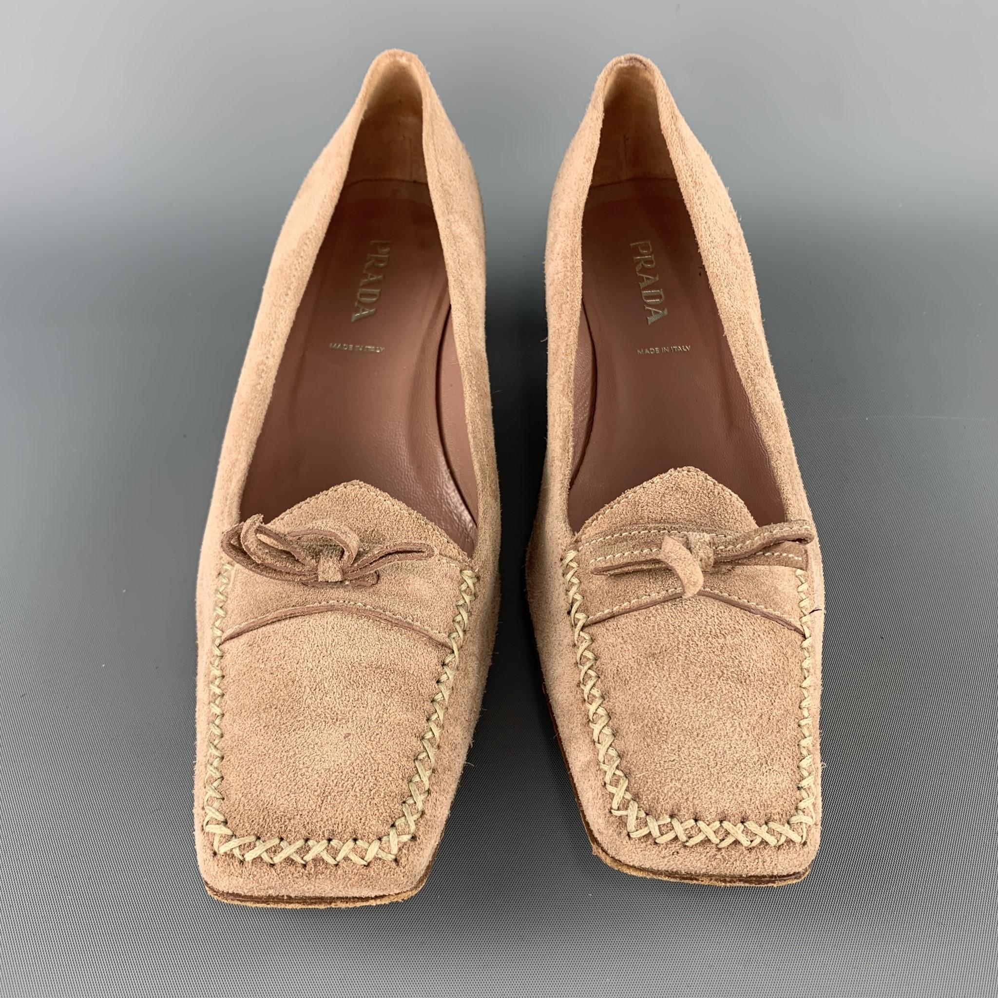 PRADA pumps come in light taupe beige suede with a contrast stitch squared apron toe, bow tie loafer strap, and kitten heel. Made in Italy.

Good Pre-Owned Condition.
Marked: IT 39.5

Heel: 1.5 in. 