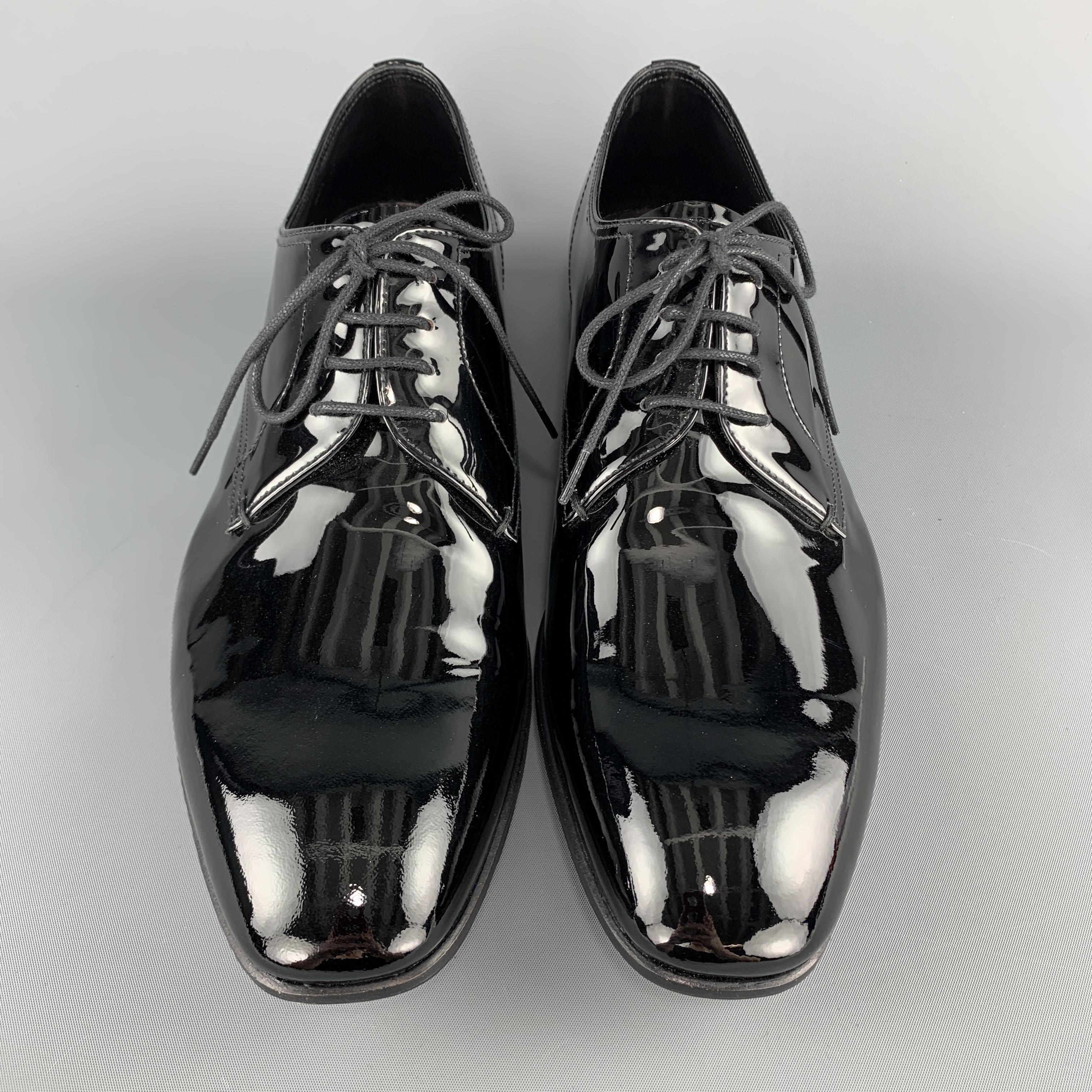 PRADA dress shoes come in black patent leather with a tapered toe and lace up front. With box. Made in Italy.

Excellent Pre-Owned Condition.
Marked: UK 8.5

Outsole: 11.5 x 4 in.