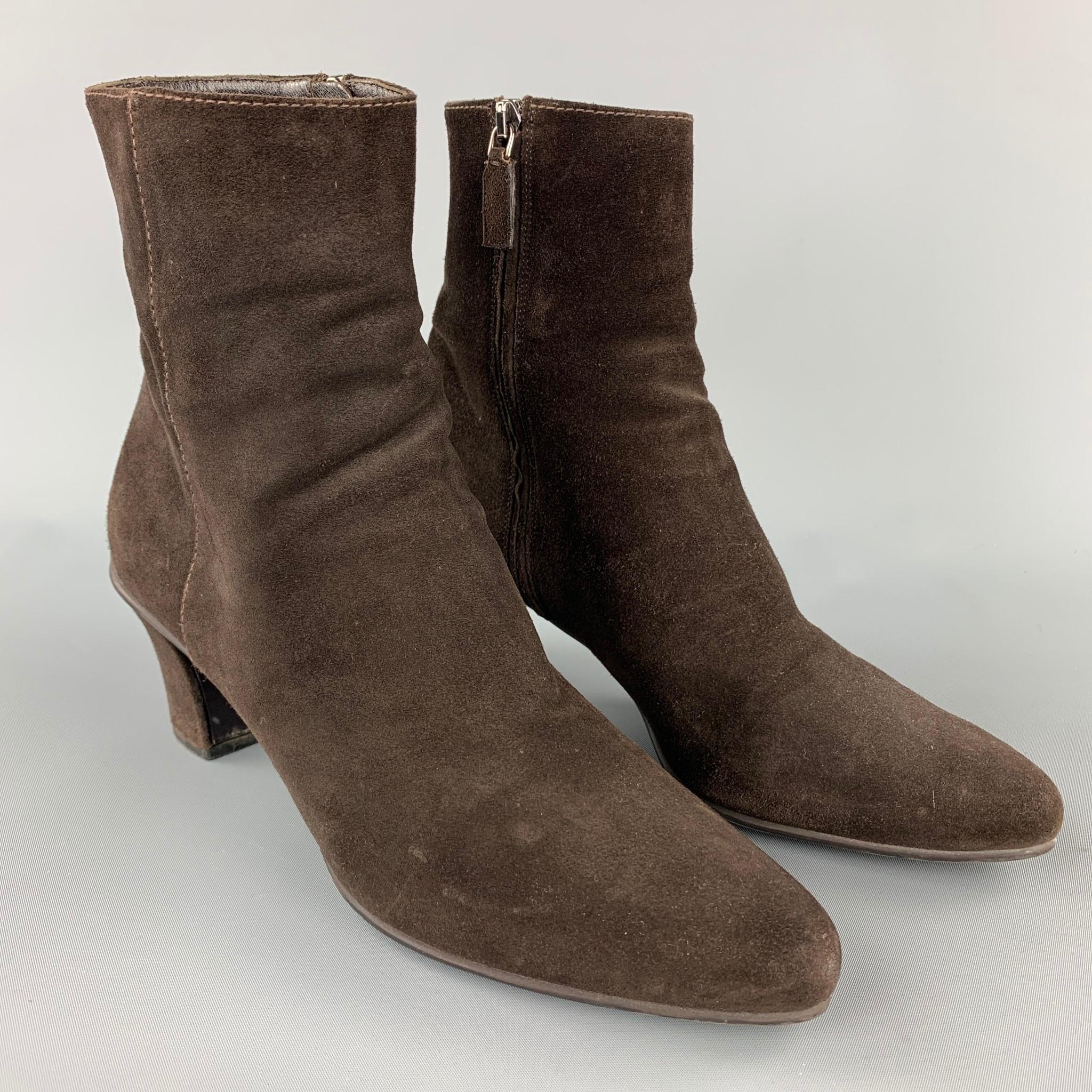 PRADA ankle boots comes in a brown suede featuring a chunky heel and a side zip up closure. Made in Italy.

Very Good Pre-Owned Condition.
Marked: UK 39.5
Original Retail Price: $995.00

Measurements:

Heel: 2.5 in.