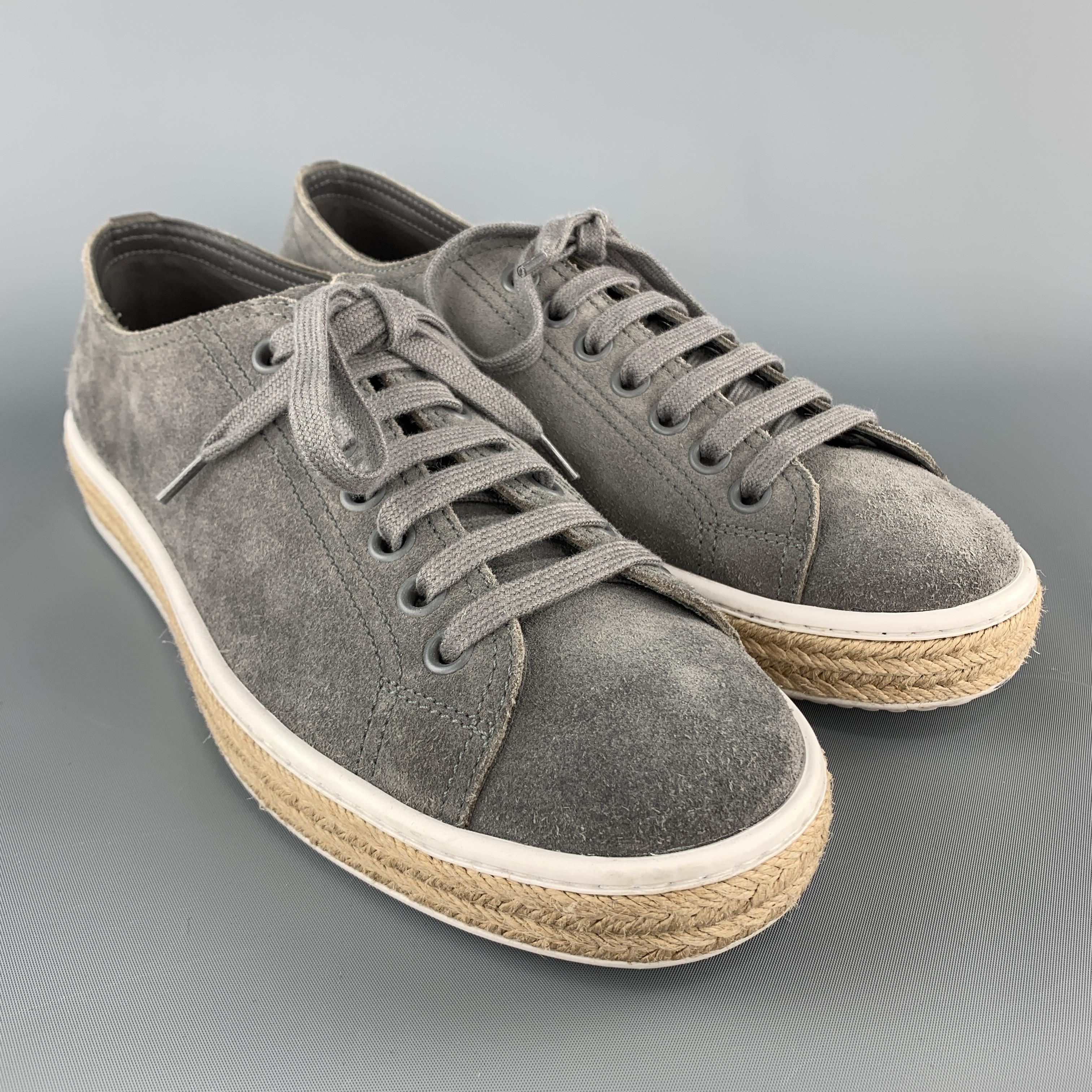PRADA low top sneakers come in gray suede with a white rubber sole and braided midsole. Made in Italy.

Very Good Pre-Owned Condition.
Marked: UK 8.5 

Outsole: 11.75 x 4 in.
