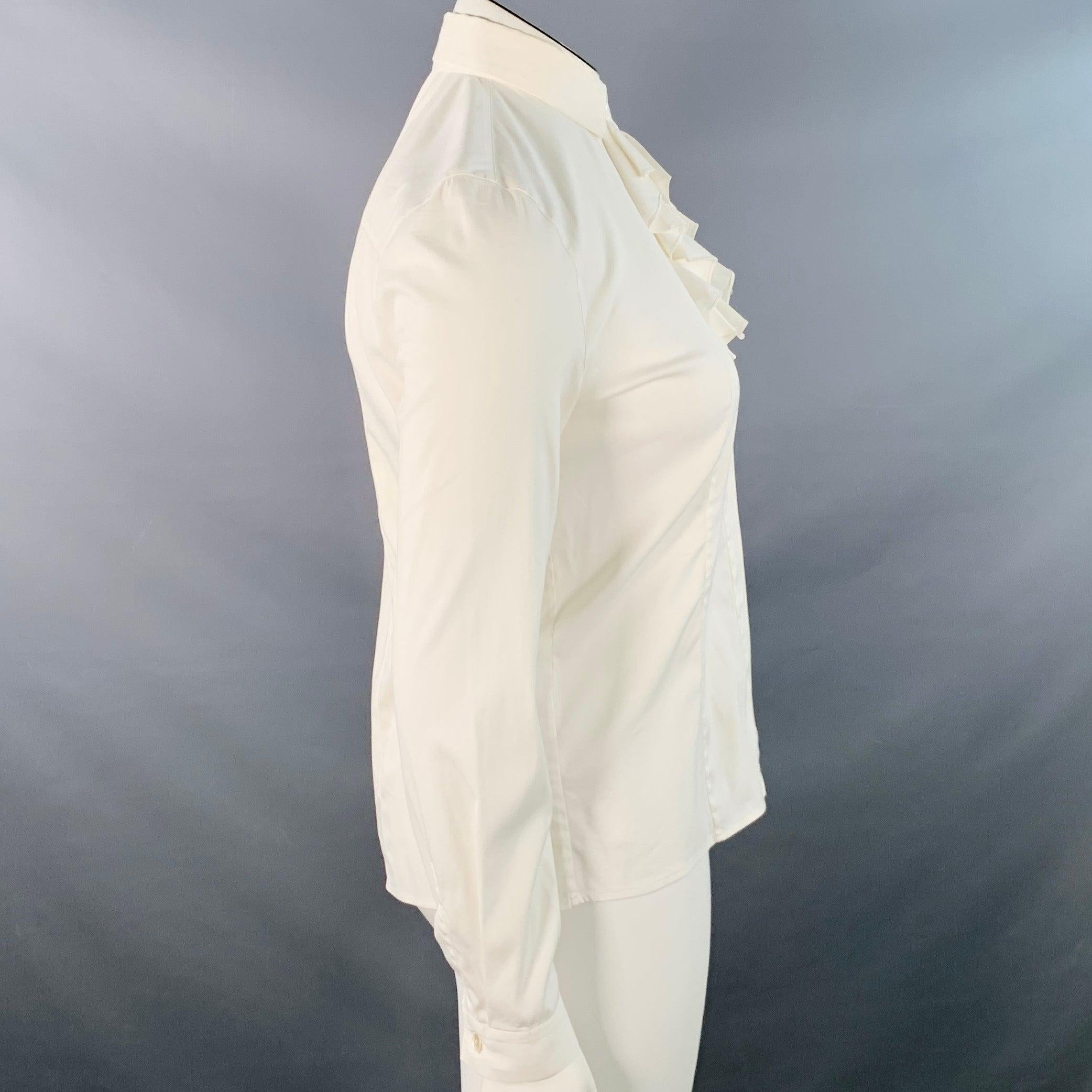 PRADA shirt
in a cream cotton blend fabric featuring a ruffled front, one button barrel cuffs, and hidden button closure. Made in Romaia.Good Pre-Owned Condition. Multiple minor marks, please check photos. As is. 

Marked:   IT 42 

Measurements: 
