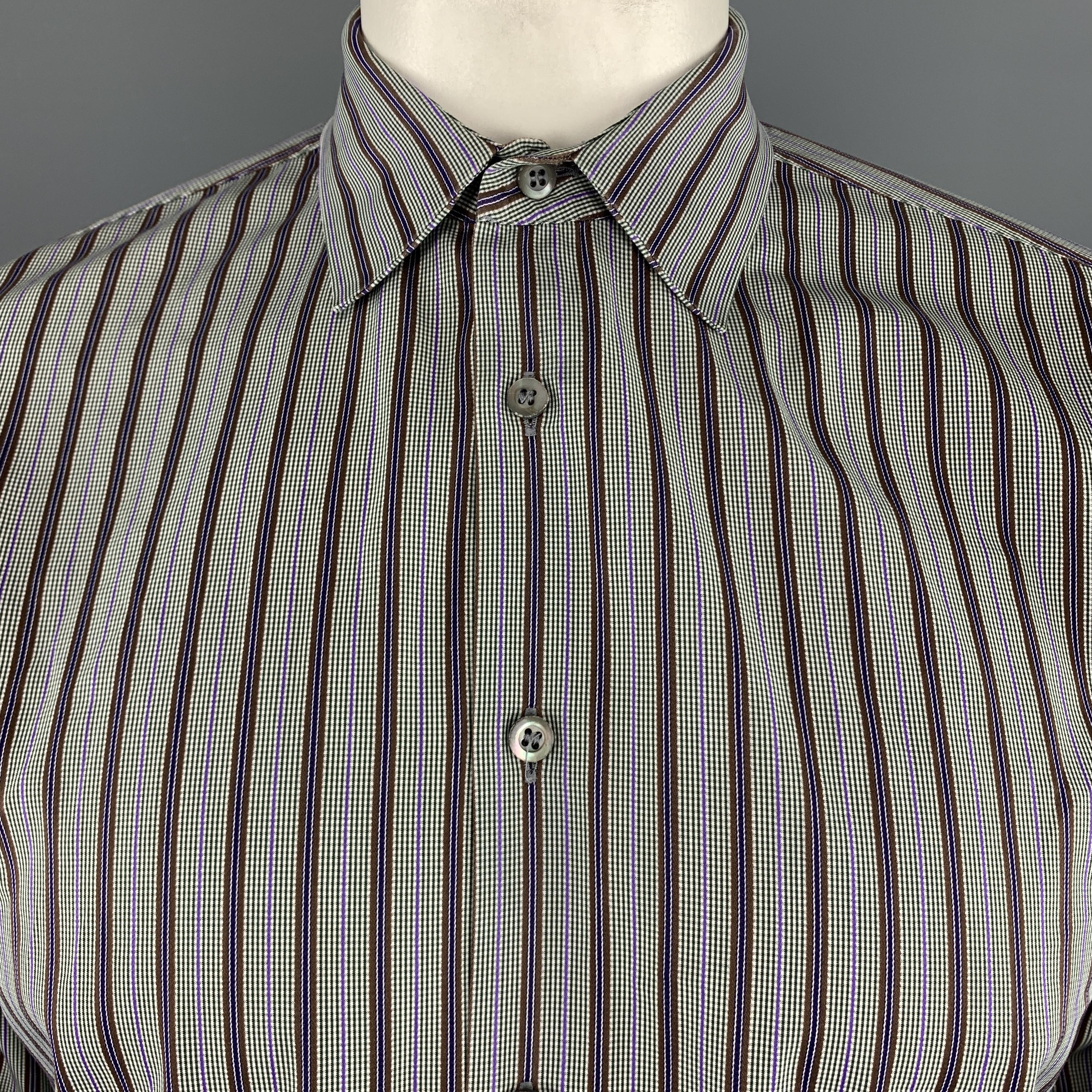PRADA dress shirt comes in light gray cotton with brown, purple, navy, and green stripe pattern throughout and a classic pointed collar. Made in Italy. 

Excellent Pre-Owned Condition.
Marked: 42/16.5

Measurements:

Shoulder: 17.5 in.
Chest: 44