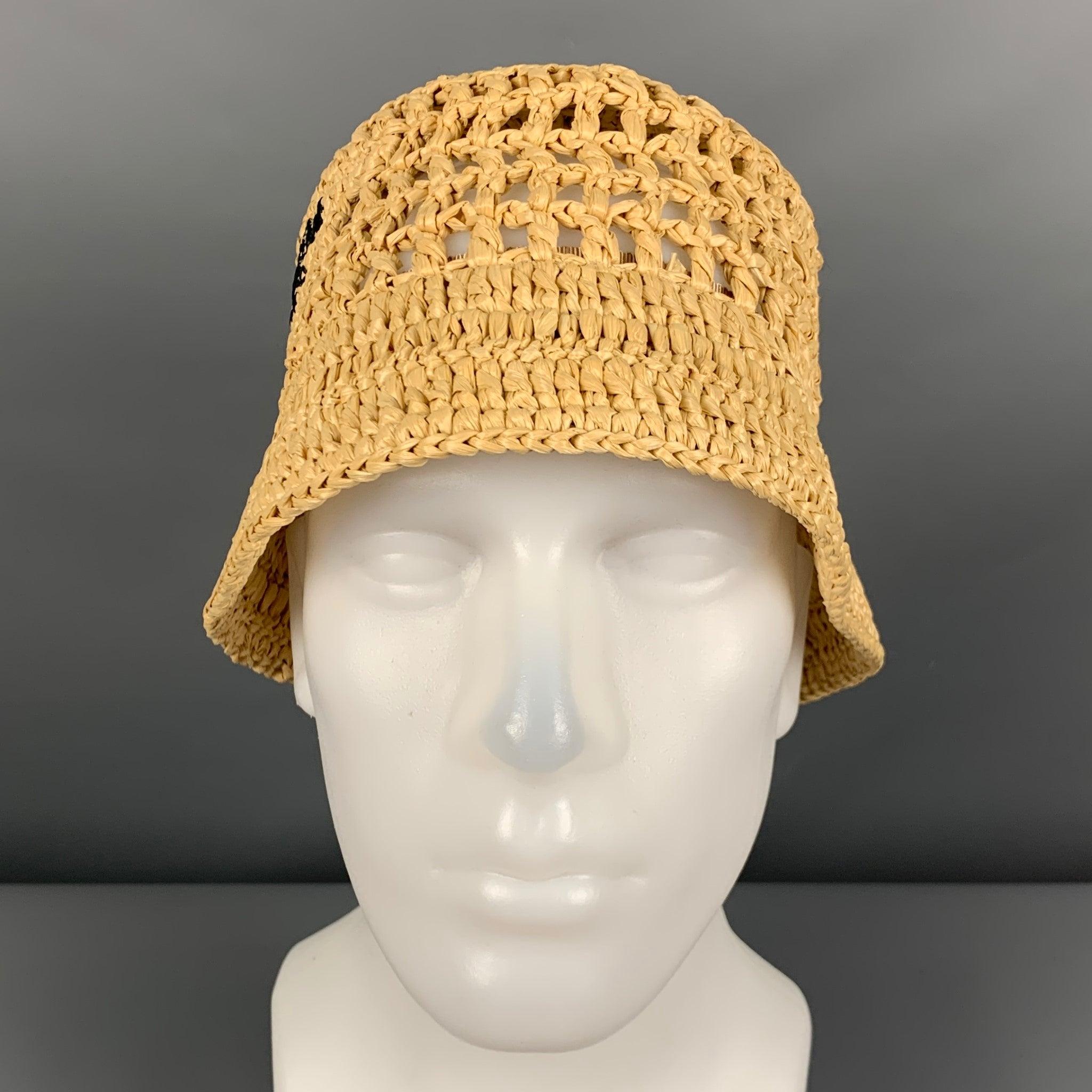 PRADA
hat in a beige viscose featuring a bucket style, crochet technique, and brand name embroidery. Made in Italy.New with Tags. 

Marked:   M 

Measurements: 
  Opening: 23 inches Brim: 2.25 inches Height: 5.25 inches  
  
  
 
Reference: