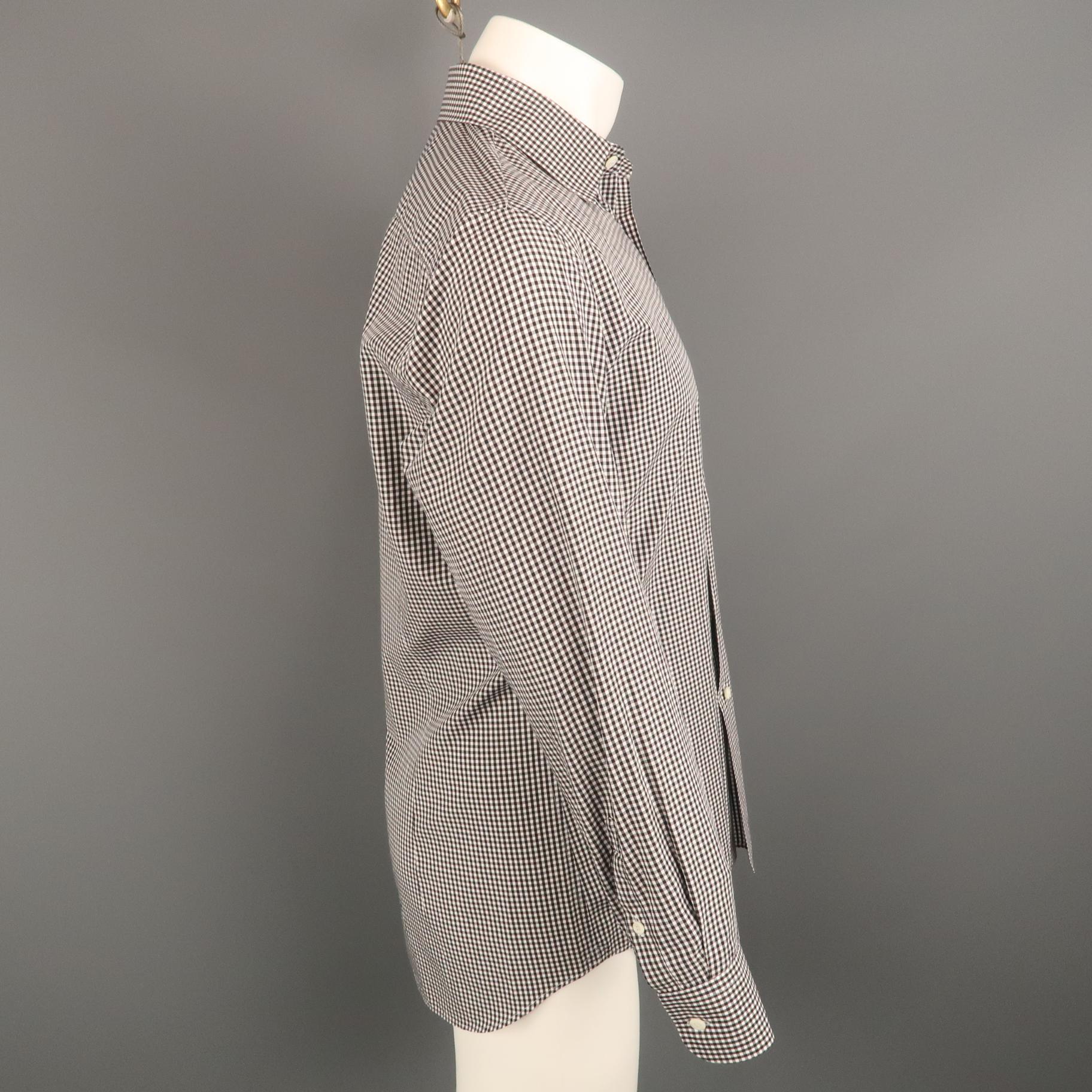 PRADA long sleeve shirt comes in a black and white checkered cotton featuring a classic button up style and a spread collar. Made in Italy.
 
Excellent Pre-Owned Condition.
Marked: 41
 
Measurements:
 
Shoulder: 17 in.
Chest: 44 in.
Sleeve: 25