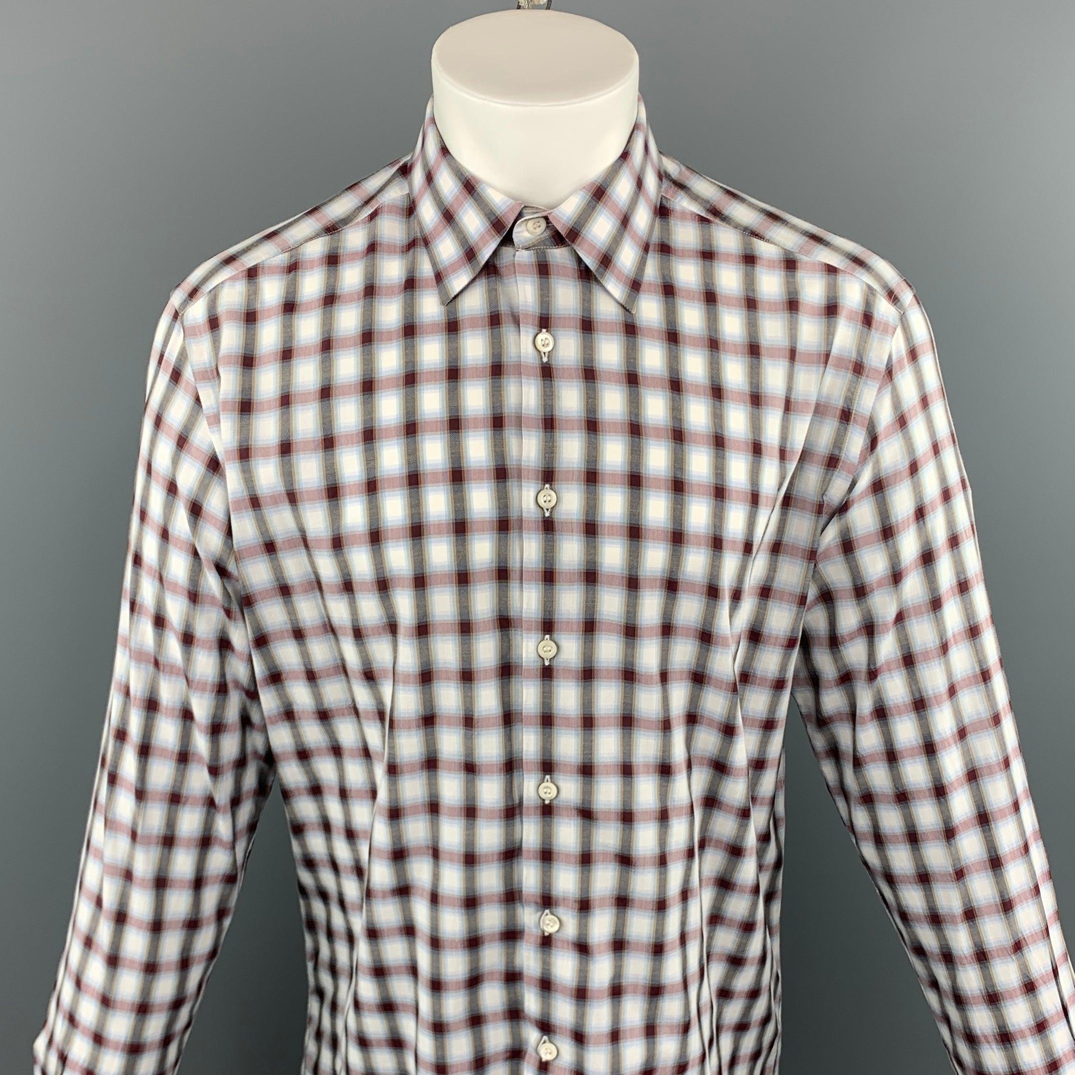 PRADA long sleeve shirt comes in a multi-color plaid cotton featuring a button up style and a spread color. Made in Italy.
Excellent Pre-Owned Condition.
 

Marked:   41
 

Measurements: 
  
l	Shoulder: 18 inches  
l	Chest: 45 inches  
l	Sleeve: 26