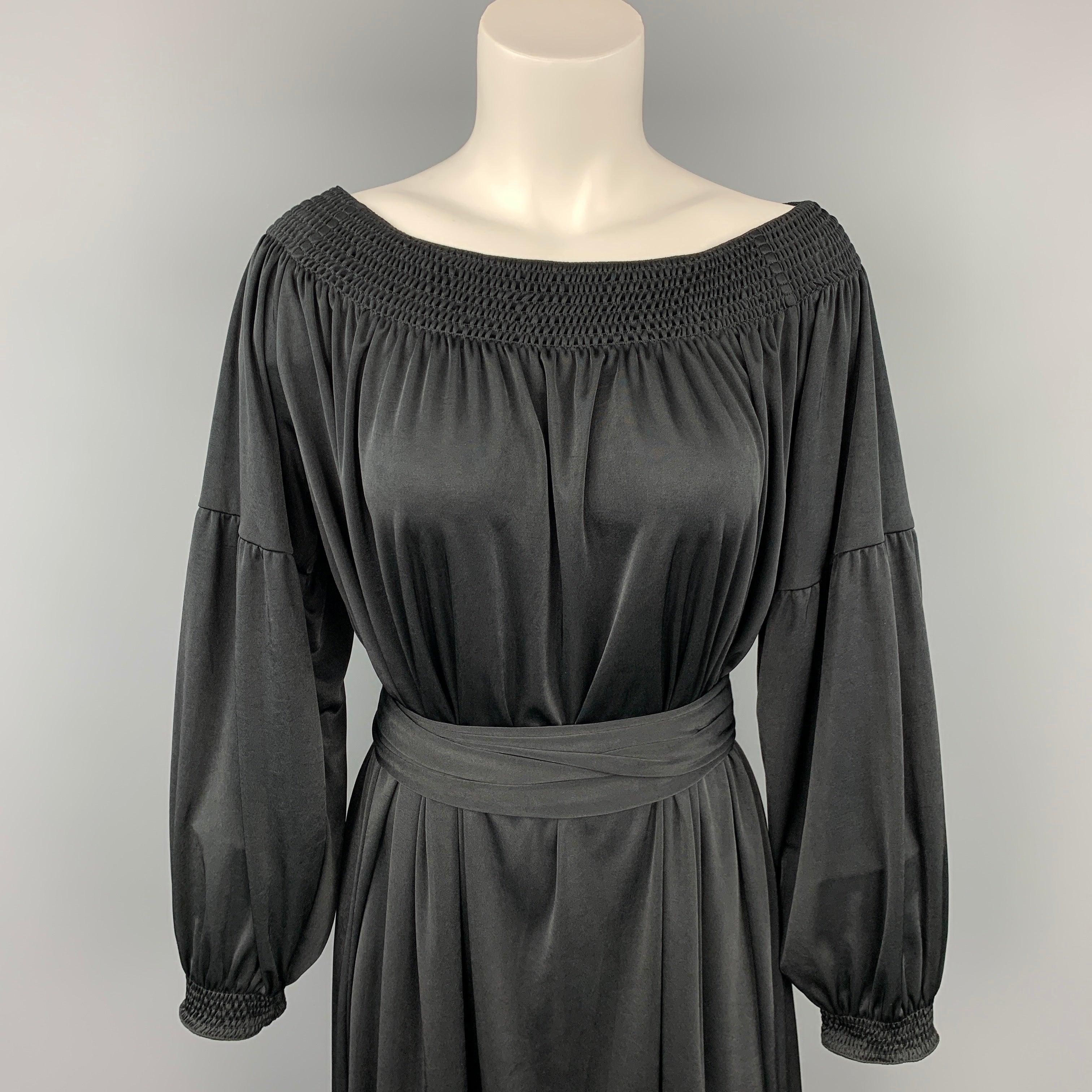 PRADA dress comes in a black jersey polyester featuring a bohemian style, belted, and 3/4 sleeves. Made in Italy.Very Good
Pre-Owned Condition. 

Marked:   S 

Measurements: 
 
Shoulder: 17 inches  Bust: 42 inches  Hip: 58 inches Sleeve: 14.5 inches