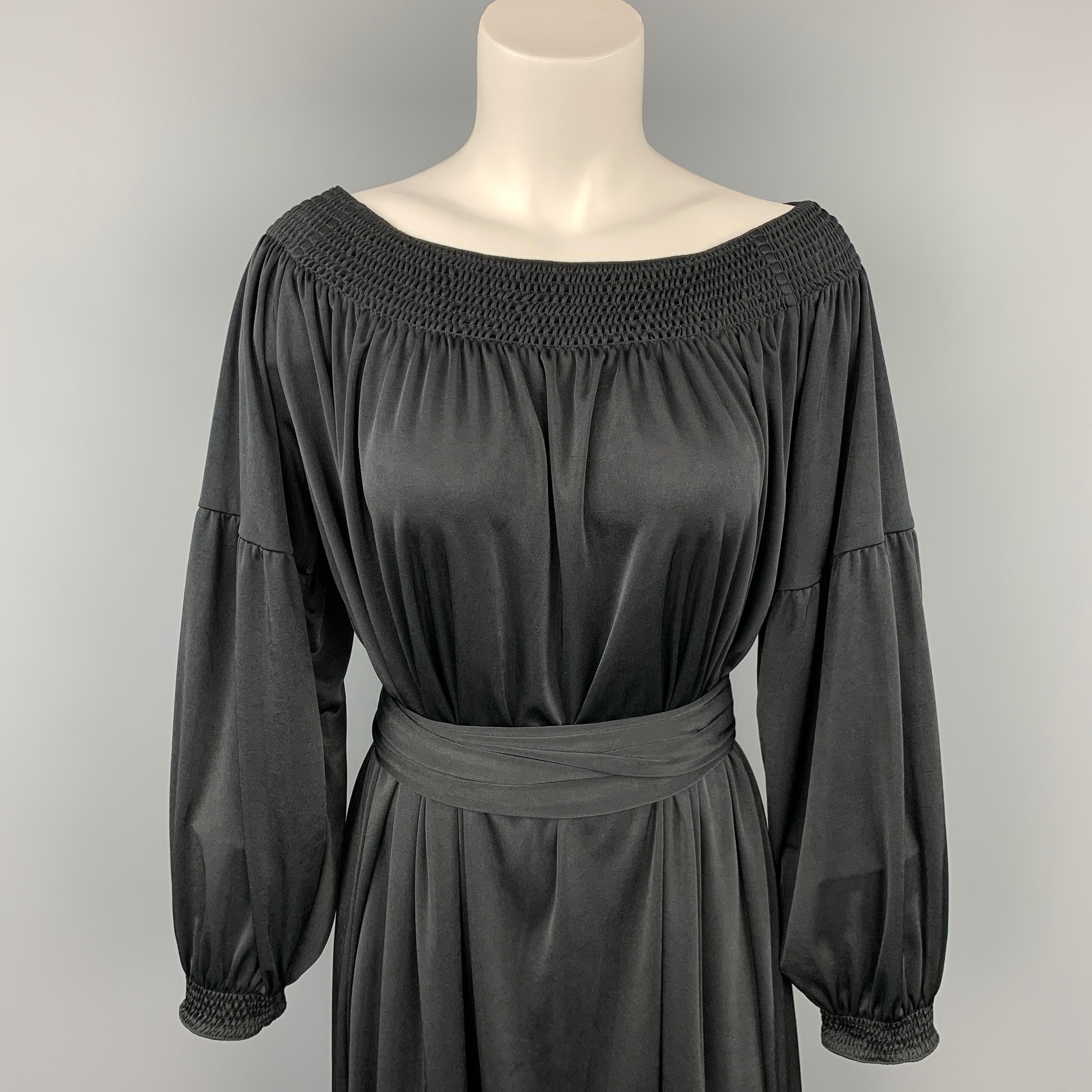 PRADA dress comes in a black jersey polyester featuring a bohemian style, belted, and 3/4 sleeves. Made in Italy.

Very Good Pre-Owned Condition.
Marked: S

Measurements:

Shoulder: 17 in.
Bust: 42 in.
Hip: 58 in.
Sleeve: 14.5 in.
Length: 37 in. 
