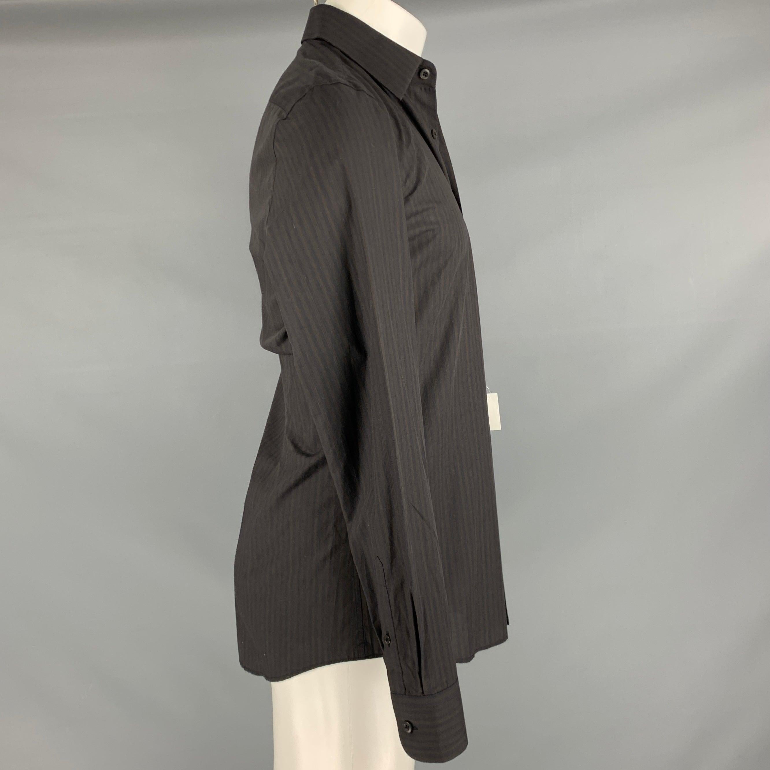 PRADA long sleeve shirt
in a brown and black cotton fabric featuring a vertical stripe pattern, spread collar, and button closure. Made in Italy.New with Tags. 

Marked:   38/15 

Measurements: 
 
Shoulder: 16.5 inches Chest: 40 inches Sleeve: 26.5