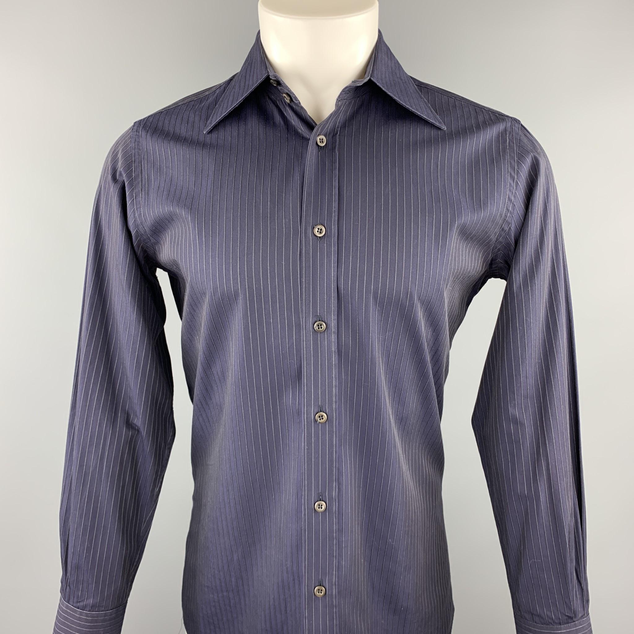 PRADA long sleeve shirt comes in a navy stripe cotton featuring a button up style and a pointed collar. Made in Italy.

Good Pre-Owned Condition.
Marked: 39/15.5

Measurements:

Shoulder: 16 in. 
Chest: 40 in.
Sleeve: 25 in. 
Length: 32 in. 