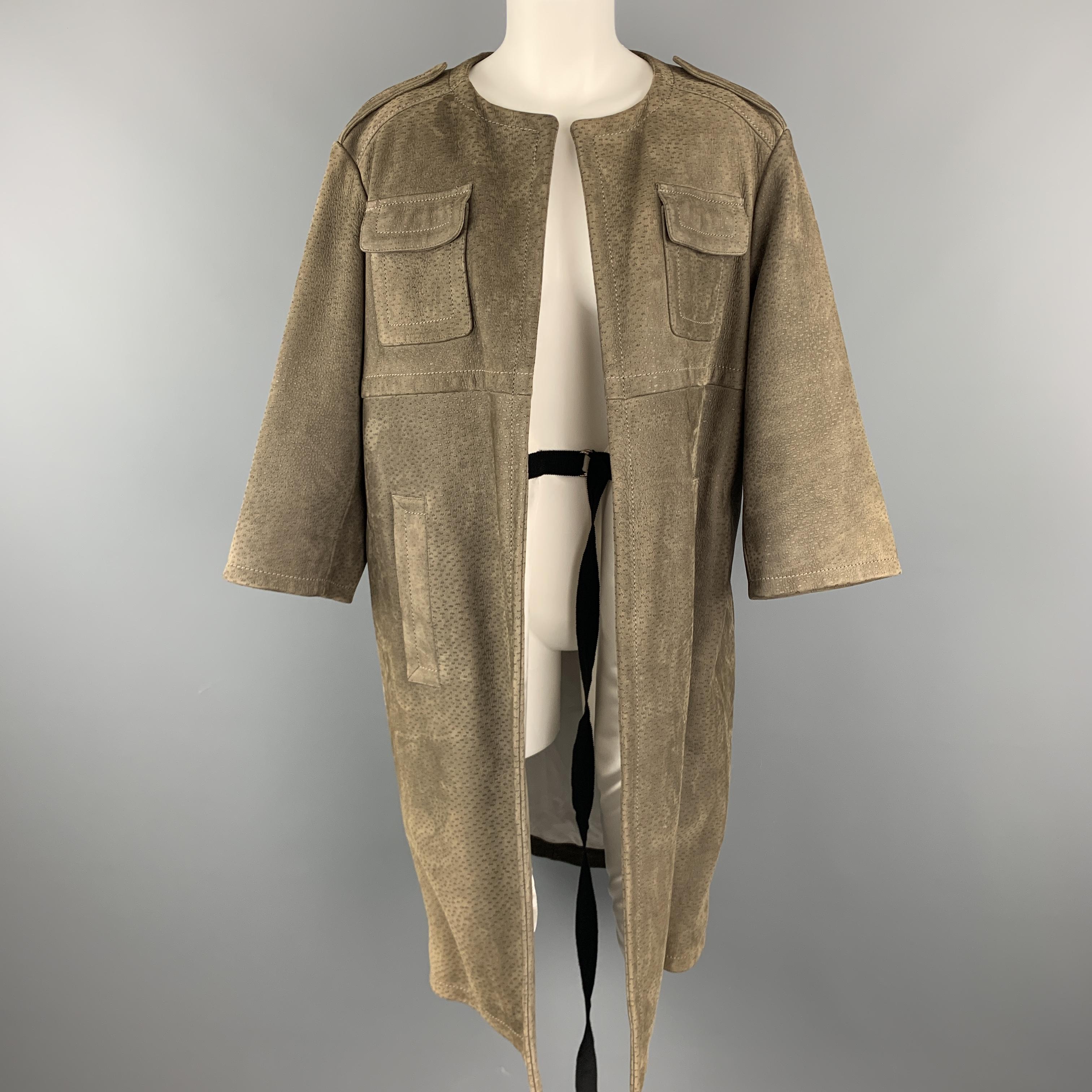 PRADA coat comes in muted olive green textured sueded leather with a collarless neckline, epaulets, drop shoulder with a cropped sleeve, patch flap pockets, inner belt, and detachable American Alligator skin dress belt. Made in Italy.

Very Good