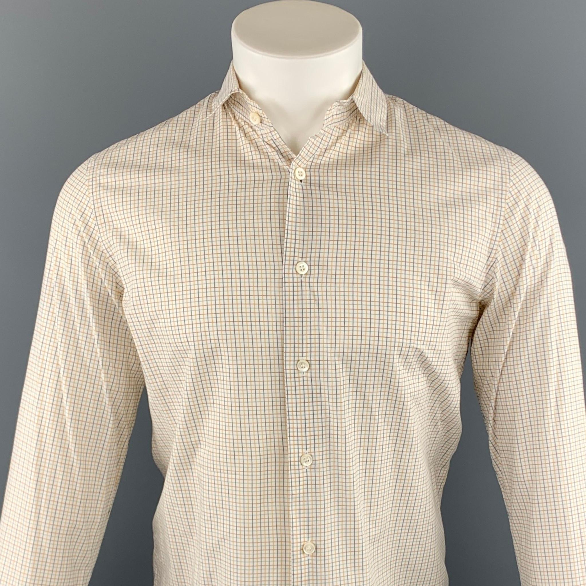 PRADA long sleeve shirt comes in a yellow window pane cotton featuring a button up style with a spread collar. Made in Italy.

Excellent Pre-Owned Condition.
Marked: 38/15

Measurements:

Shoulder: 16 in. 
Chest: 40 in. 
Sleeve: 26 in. 
Length: 28.5