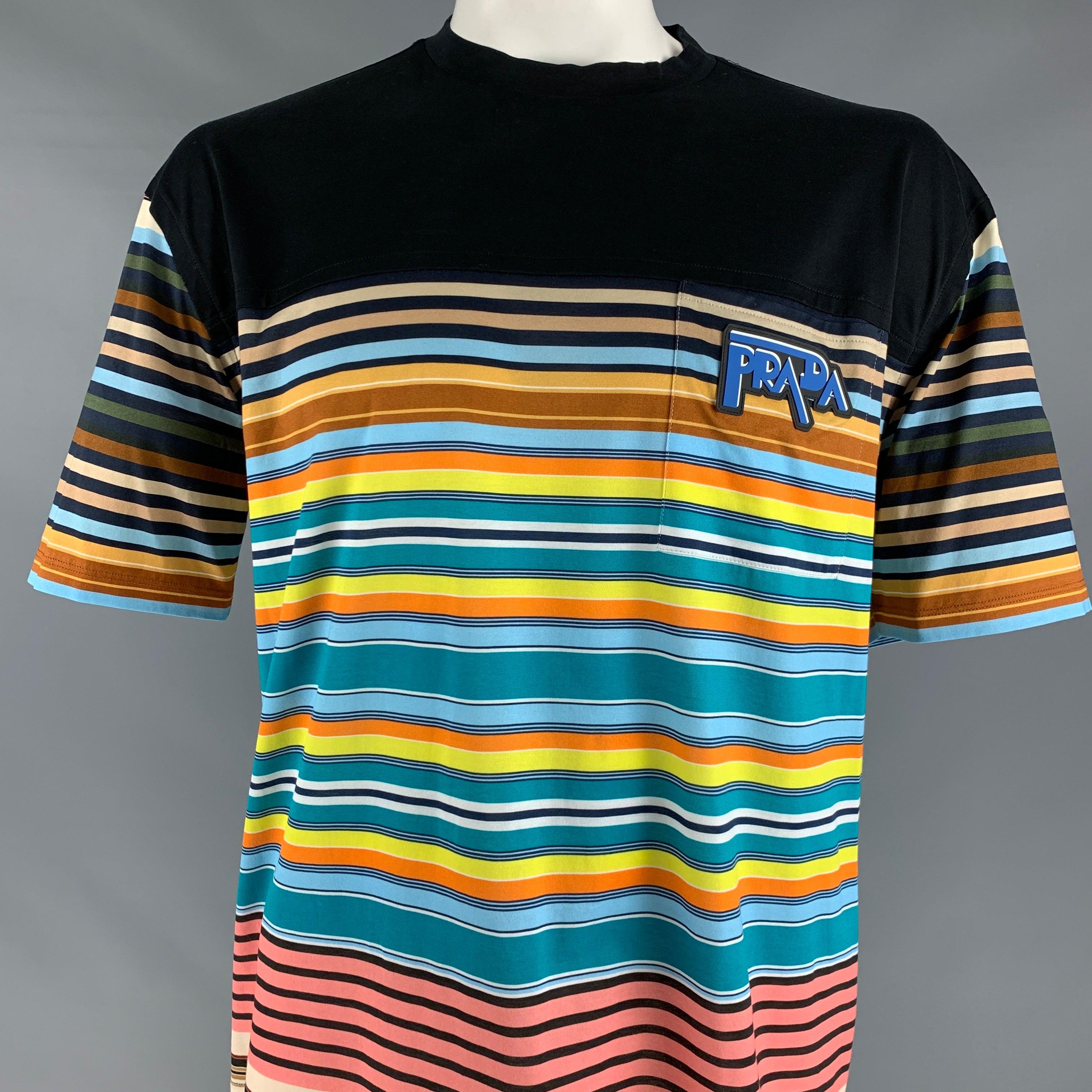 PRADA t-shirt
in a black cotton fabric featuring multi-color horizontal stripes, one pocket with Prada applique, and a crew neck. Made in Romania.Excellent Pre-Owned Condition. 

Marked:   IT 48 

Measurements: 
 
Shoulder: 24 inches  Chest: 49