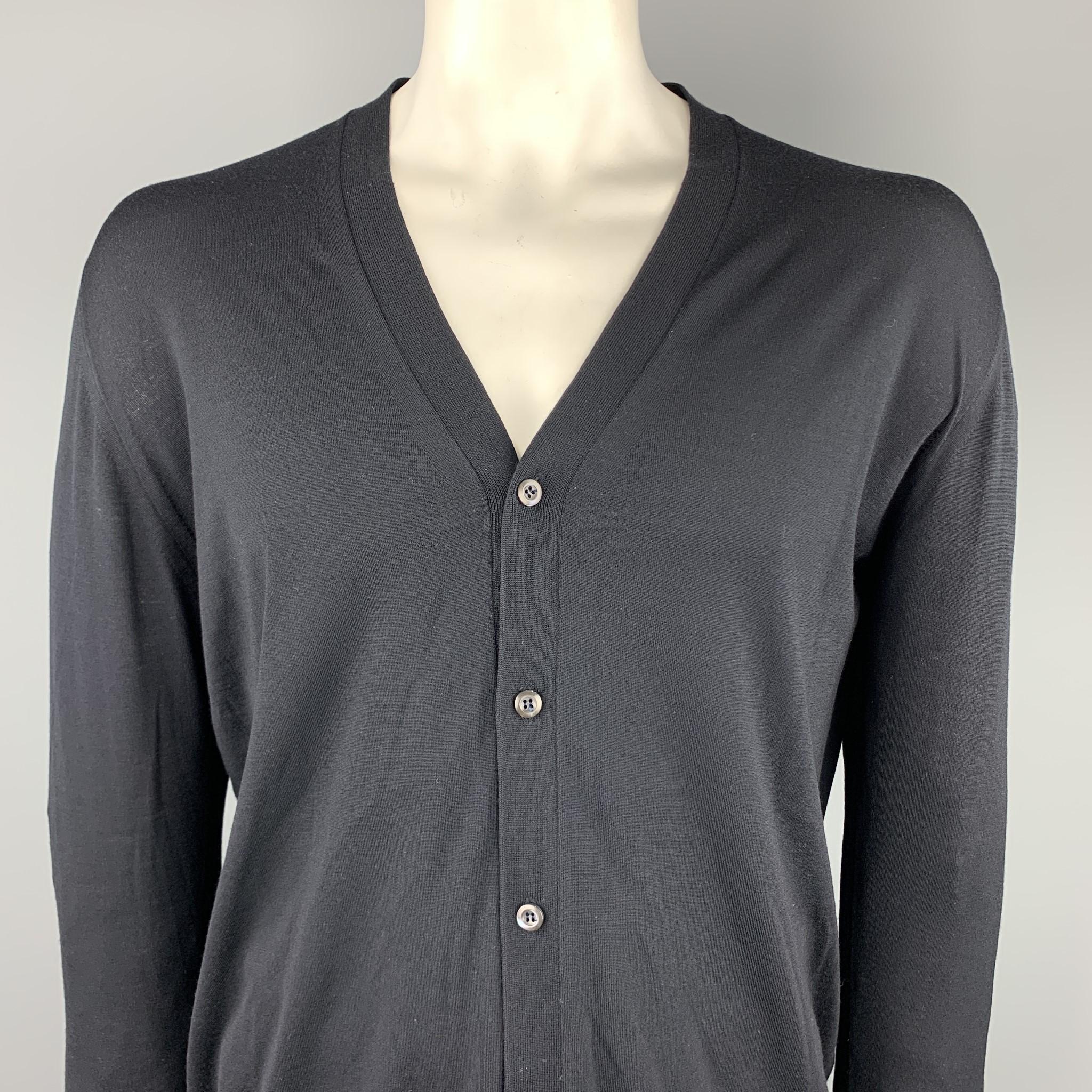 PRADA cardigan comes in a black wool featuring a buttoned closure. Made in Italy

Excellent Pre-Owned Condition.
Marked: IT 56

Measurements:

Shoulder: 16.5 in. 
Chest: 46 in.
Sleeve: 26.5 in. 
Length: 28 in. 