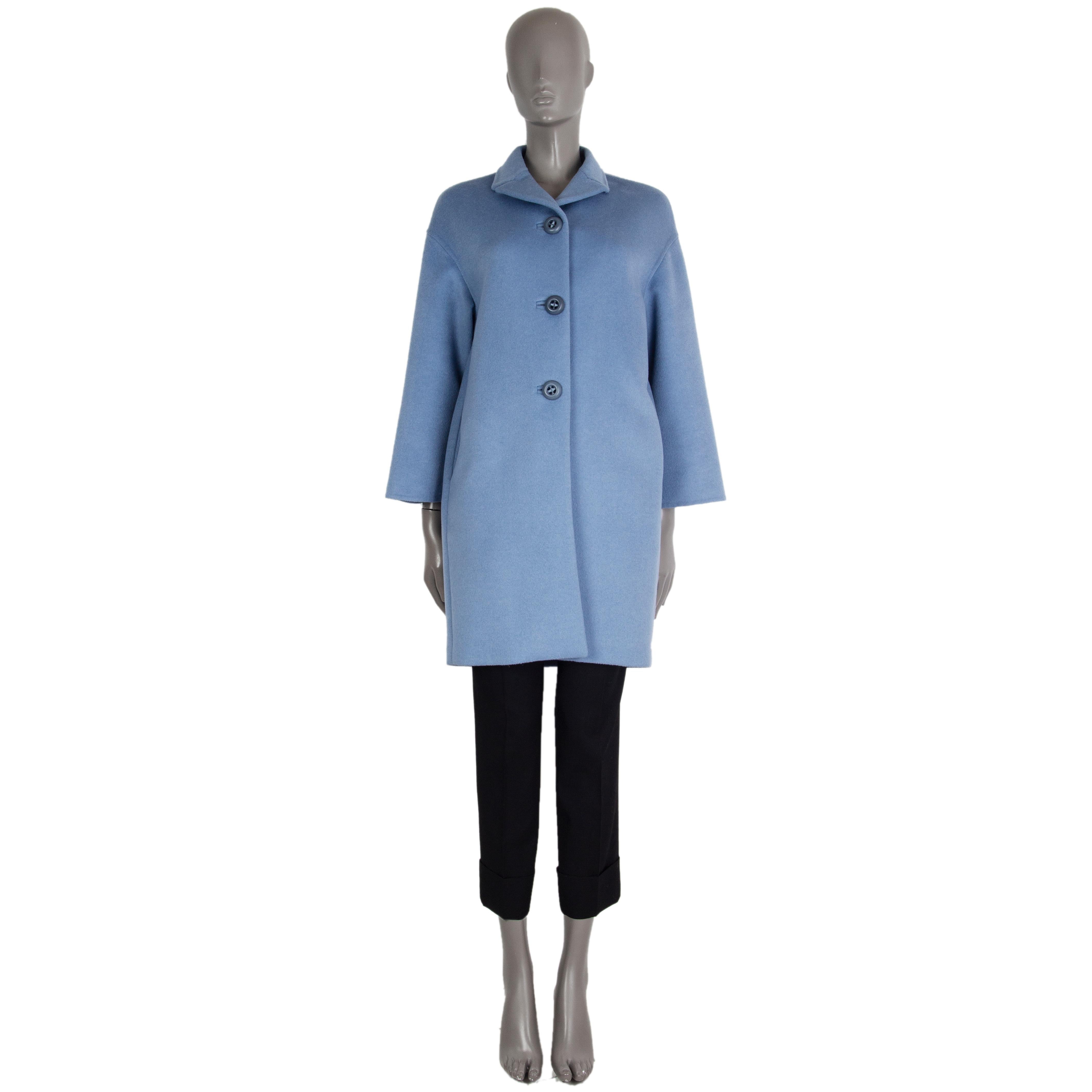 100% authentic Prada single breasted coat in sky blue virgin wool (55%), angora (40%) and cashgora (5%) with a notch collar. Closes on the front with buttons. Lined in viscose (100%). Has been worn and is in excellent condition.  

Measurements
Tag