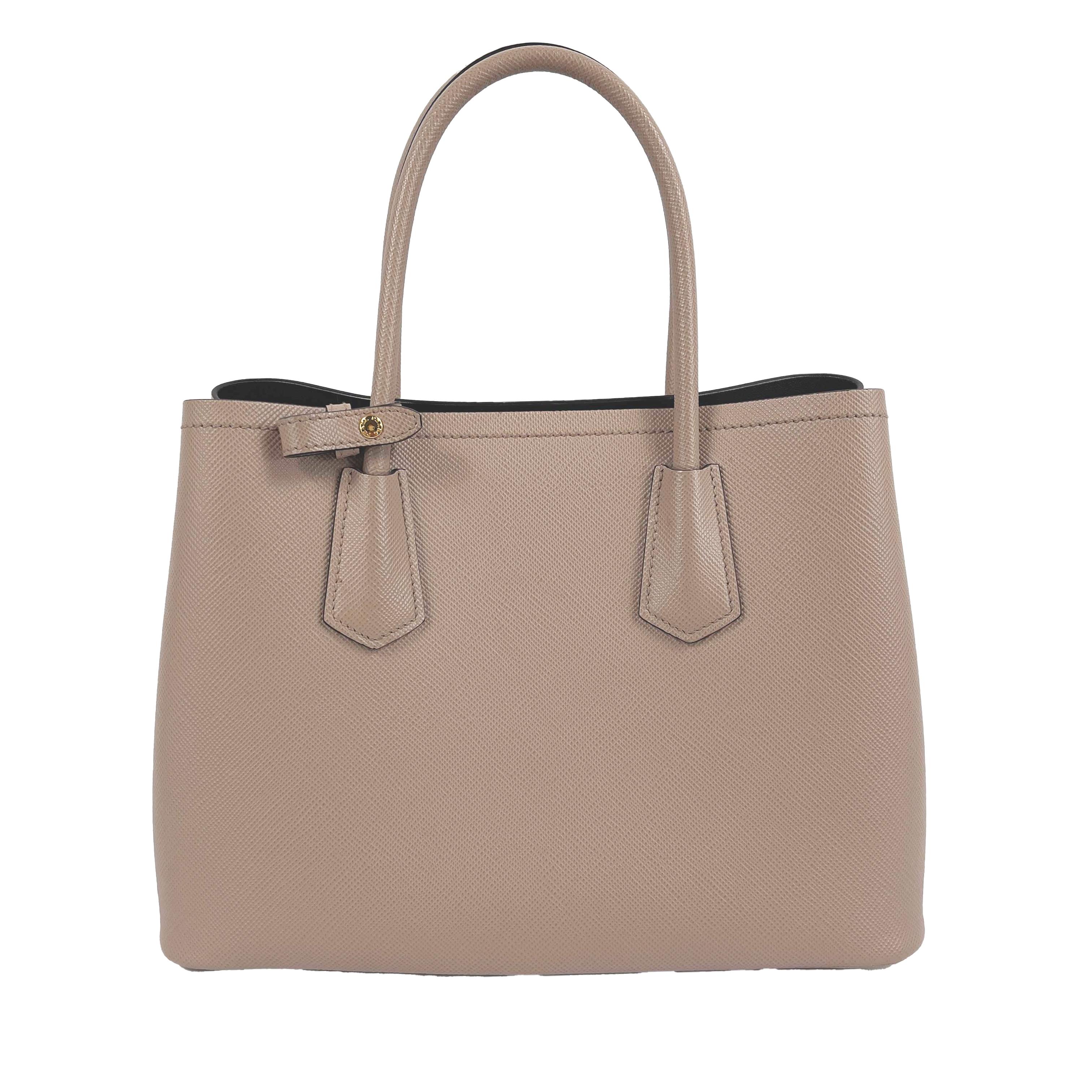 Prada - Small Saffiano Leather Double Bag Tote - Powder Pink / Black w/ Strap

Description

This Prada Double tote is crafted in Saffiano leather. It features a double handle, detachable shoulder strap and nappa leather lining, all accented with