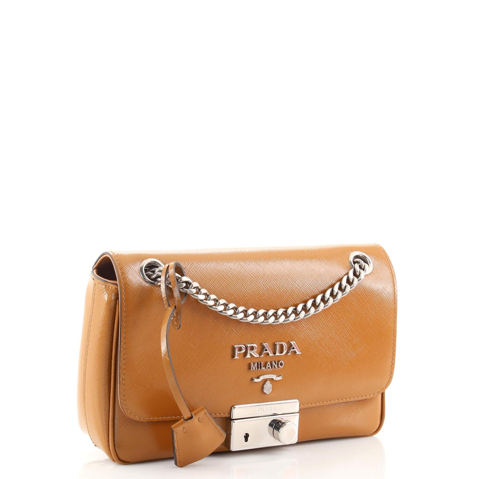 Condition: Good. Creasing and marks on exterior, discoloration on rear edges, slight bubbling and wear on shoulder pad. Cracking on opening corners, creasing underneath flap, scratches on hardware.
Accessories: Keys, Clochette
Measurements: Handle
