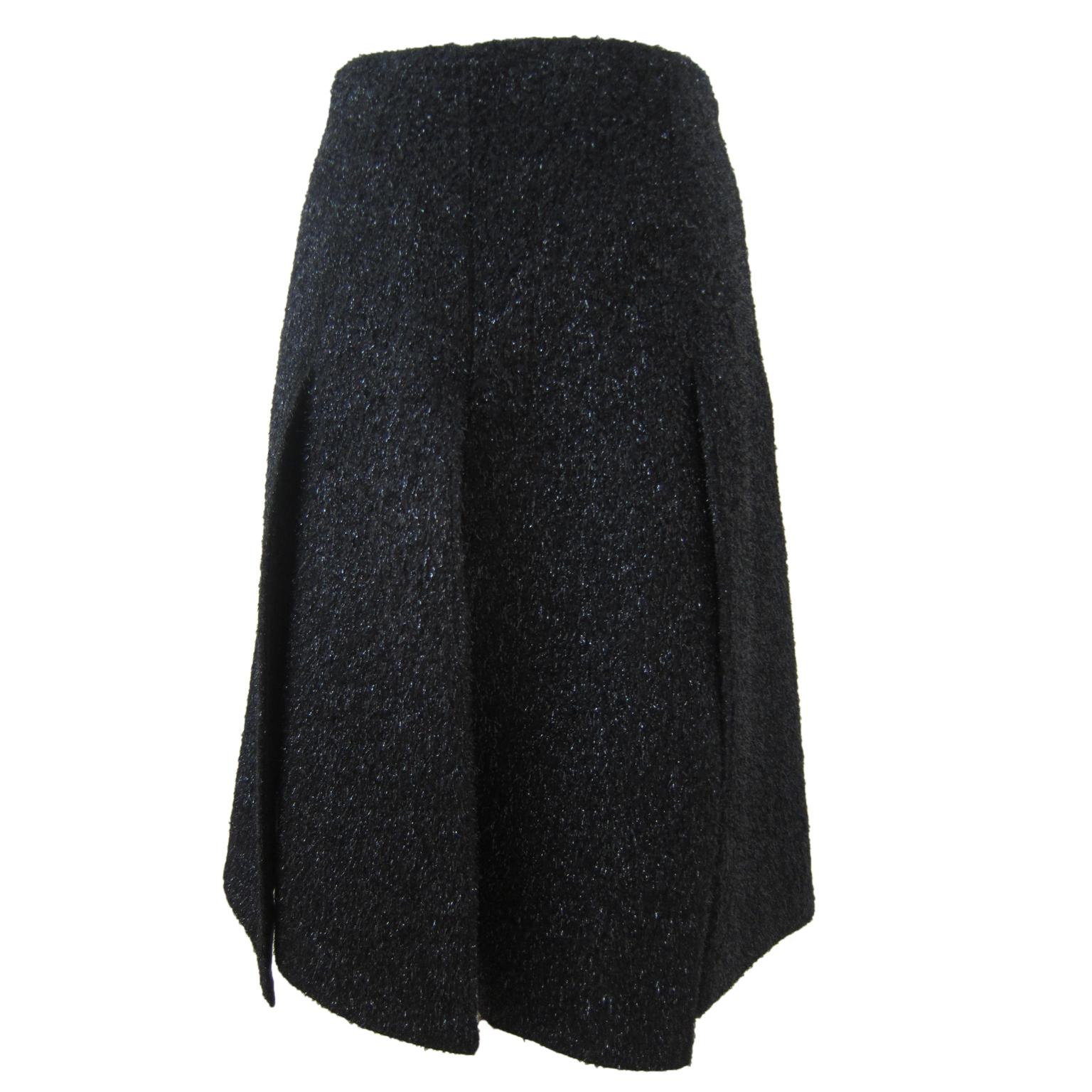 Prada skirt with slits in black metallic fuzzy like material. It consists of 6 panels that are split up very calculated pattern to be fit well on body. 
It has zipper closure.
Size : 40 (IT) 
Measurements :
Length : 53 cm
Waist : 70 cm