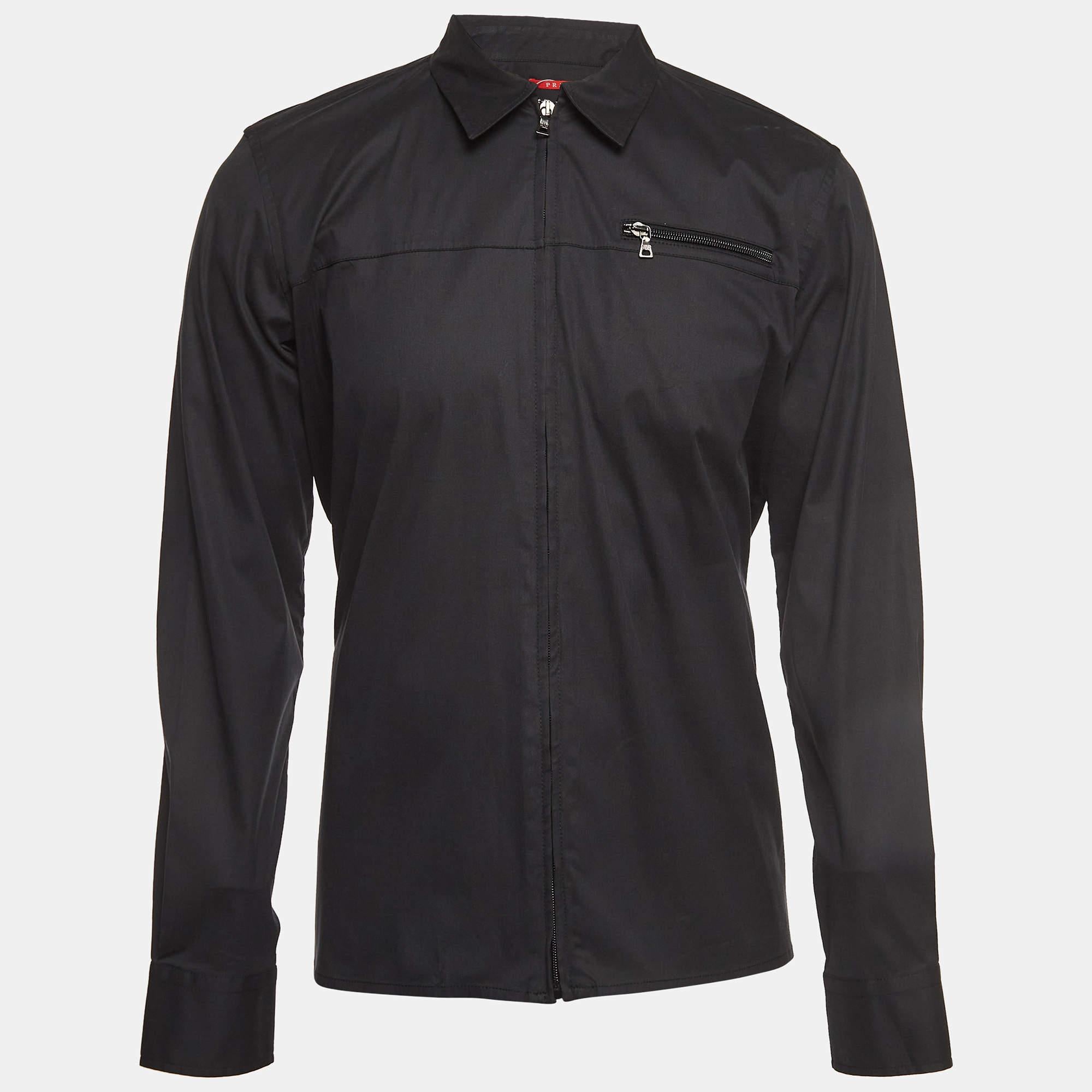 This Prada Sport black jacket offers the satisfaction of a comfortable fit and refined style. It is made of quality fabrics and designed with a front zipper, pocket, and long sleeves.

