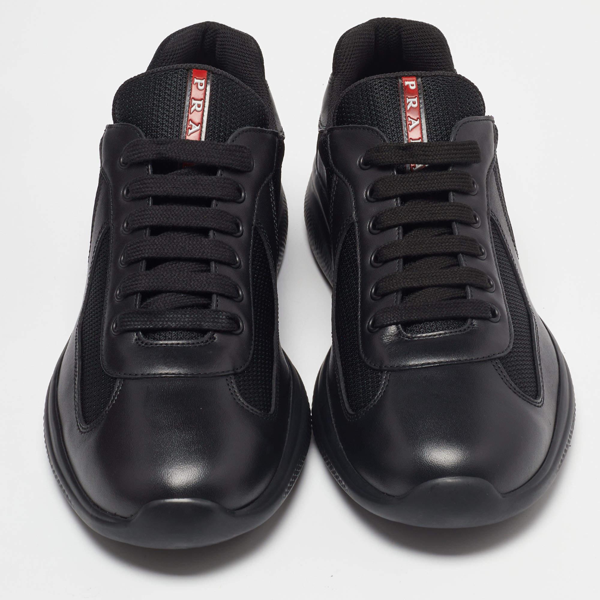 Built to last and add sophistication to any outfit, these leather and mesh sneakers are all you need. These Prada America's Cup sneakers carry a timeless black hue and a sturdy rubber sole that lends ultimate comfort.

Includes: Original Dustbag,