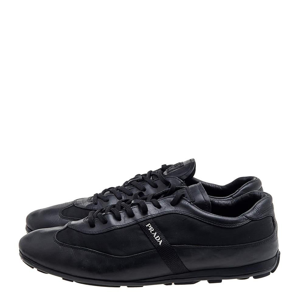 Prada Sport brings you these super stylish sneakers to elevate your appearance! They are crafted using black nylon and leather into a sturdy low-top silhouette. They exhibit lace-up fastenings and silver-tone hardware. Walk with style and confidence