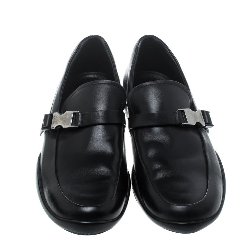 Purposely created to exude style and provide comfort wherever you go, this pair of loafers by Prada is absolutely worth the buy! They've been crafted from leather, styled with safety buckles and finished with rubber pebbling on the