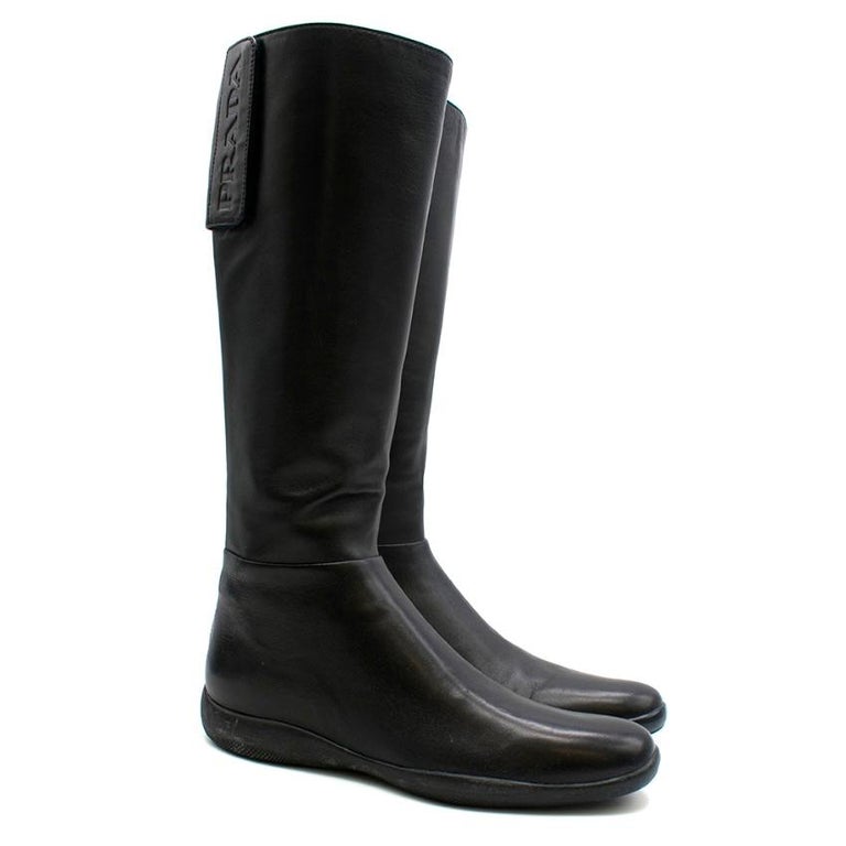 Prada Sport Black Leather Flat Knee Boots 39 at 1stDibs | flat black  leather knee high boots, prada loafers