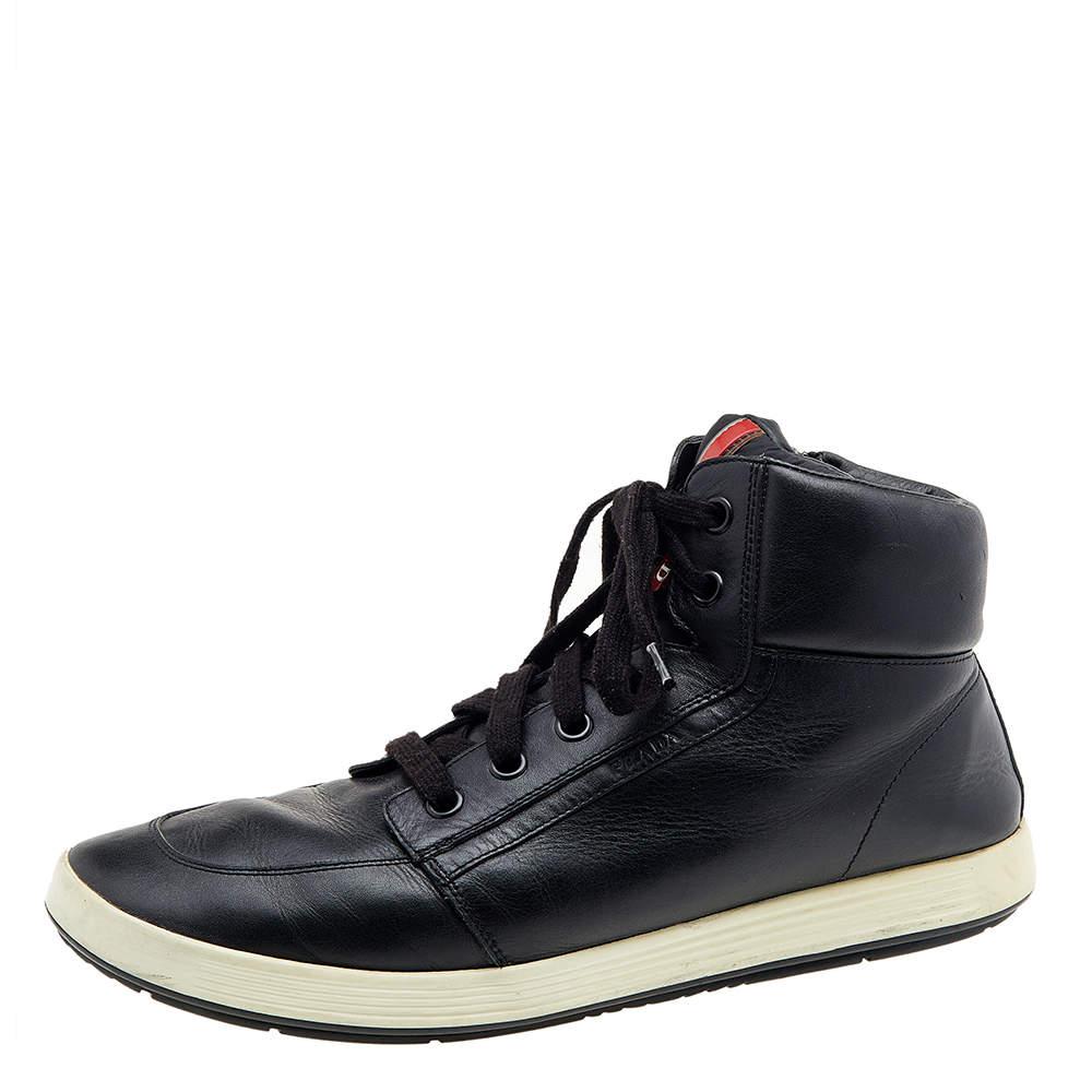 Coming in a high-top silhouette, these Prada Sport sneakers are a seamless combination of luxury, comfort, and style. They are made from leather in a black shade. These sneakers are designed with logo details, laced-up vamps, and comfortable
