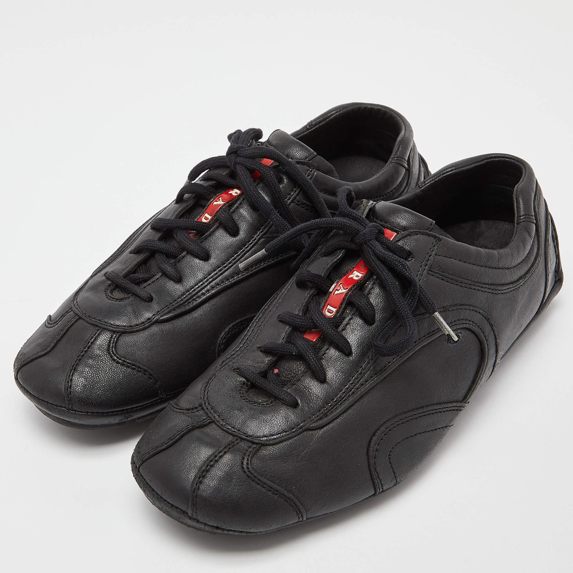 Durable and stylish these low top sneakers designed by Prada Sport are all you need. Not only do these sneakers provide maximum comfort but they also help your outfit look sophisticated and suave. Black leather is used to craft its exterior.