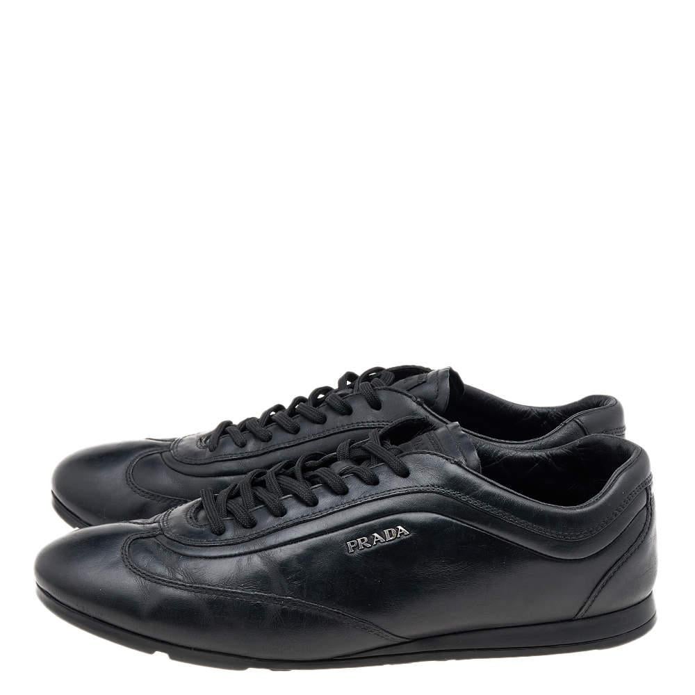 Prada Sport brings you these super stylish sneakers to elevate your appearance! They are crafted using black leather on the exterior. They exhibit lace-up fastenings and gunmetal-tone hardware. Walk with style and confidence in these sneakers!

