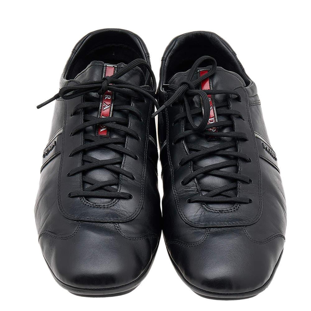 Coming in a classic low-top silhouette, these Prada Sport sneakers are a seamless combination of luxury, comfort, and style. They are made from leather in a black shade. These sneakers are designed with logo details, laced-up vamps, and comfortable