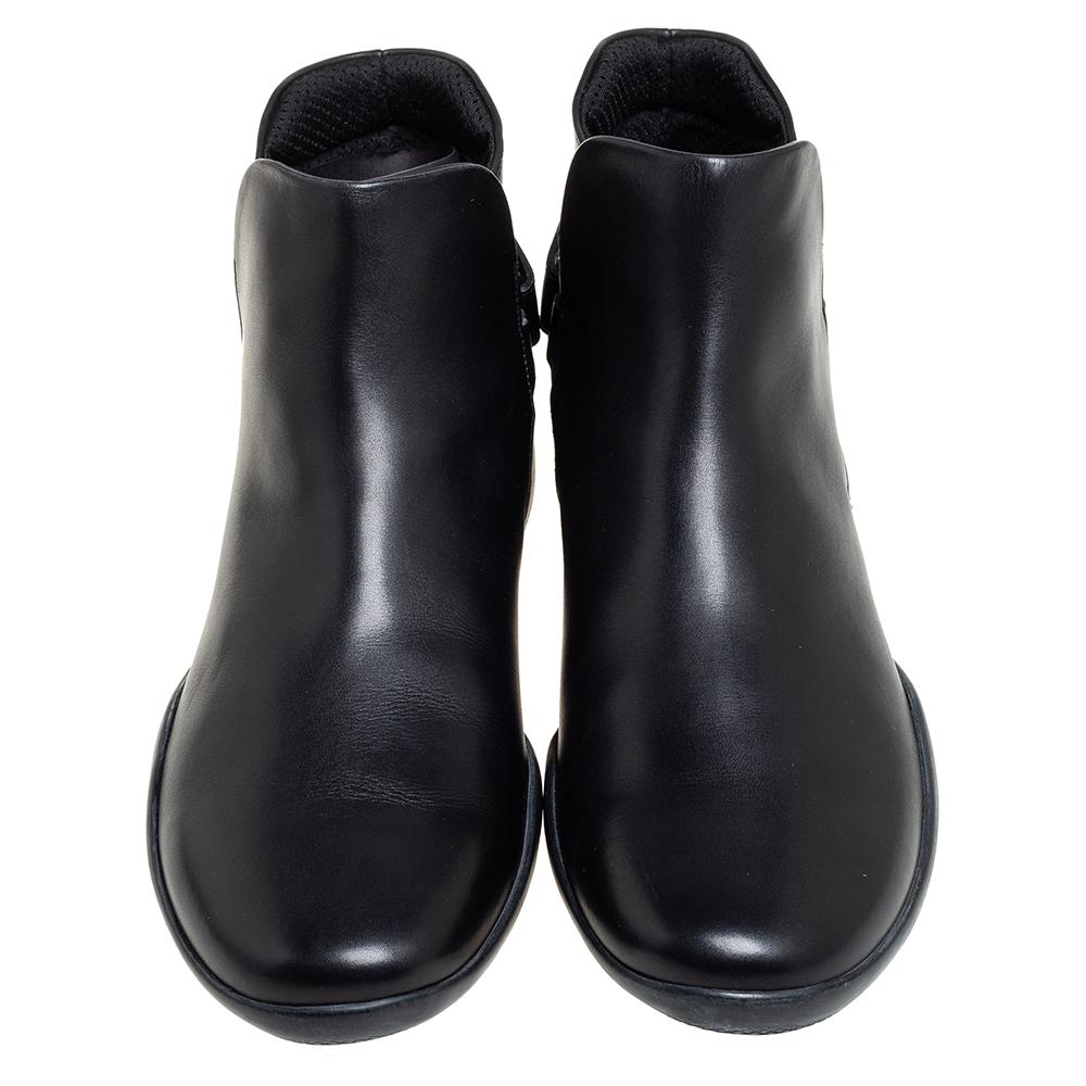 Celebrating the fusion of fine craftsmanship and luxury fashion, these Prada Sport boots are absolutely worth the splurge. They are laceless and so well-crafted with leather. The boots are detailed with velcro straps on the counters and comfortable