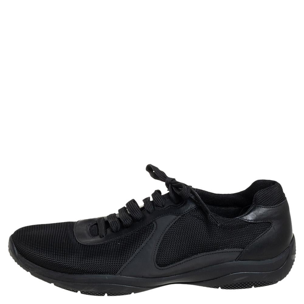 Simultaneously trendy and unique, these dashing Prada sneakers champion modern design. These black sneakers feature a round toe, a lace-up front fastening, a branded insole and a rubber sole. These striking sneakers can easily be worn