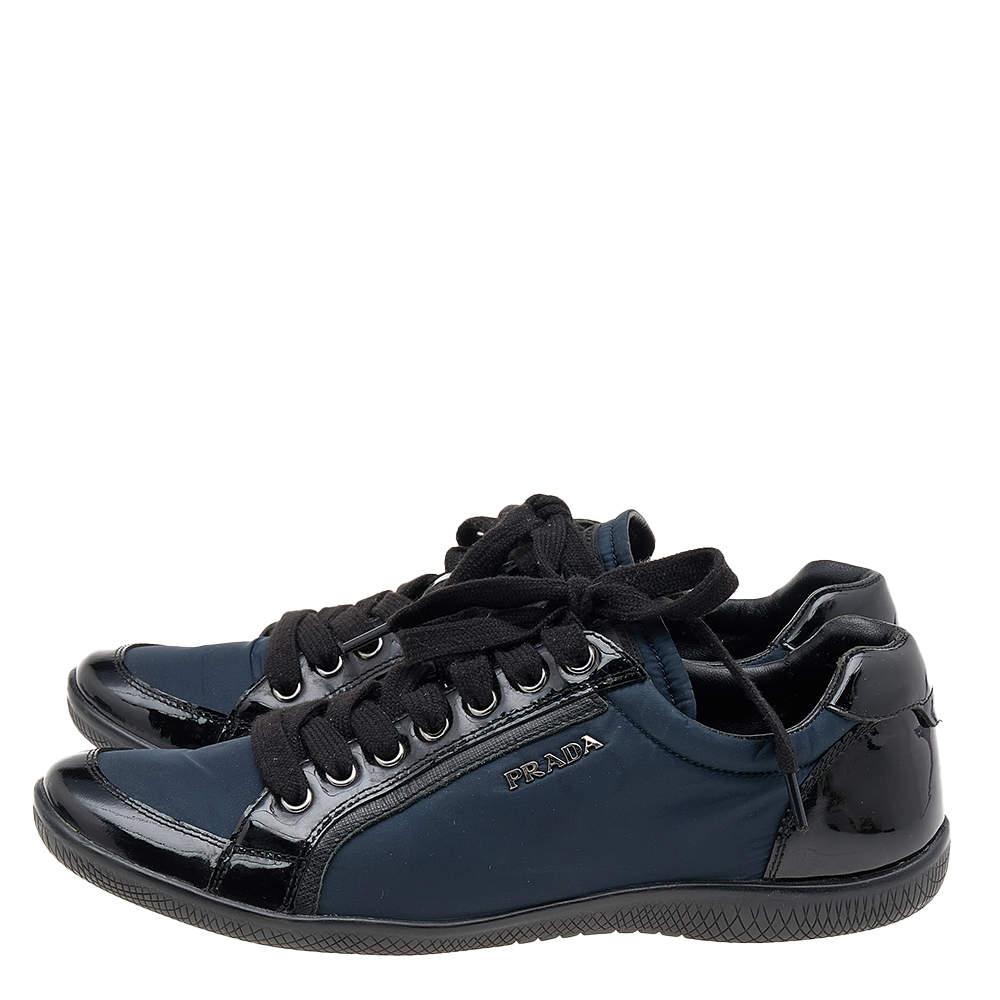 A pair that will see you through a long day in full comfort! Crafted using nylon and patent leather, these Prada Sport sneakers are designed in a low-top style, secured with lace-ups, and set atop durable rubber soles.

