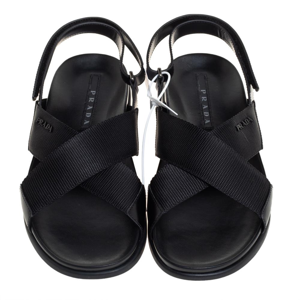 Ideal for a trendy appeal, these stylish sandals by Prada Sport are crafted using premium quality leather & nylon. They come with a black hue and buckles on the slingbacks. An open-toe design elevates the overall look. They make excellent picks for