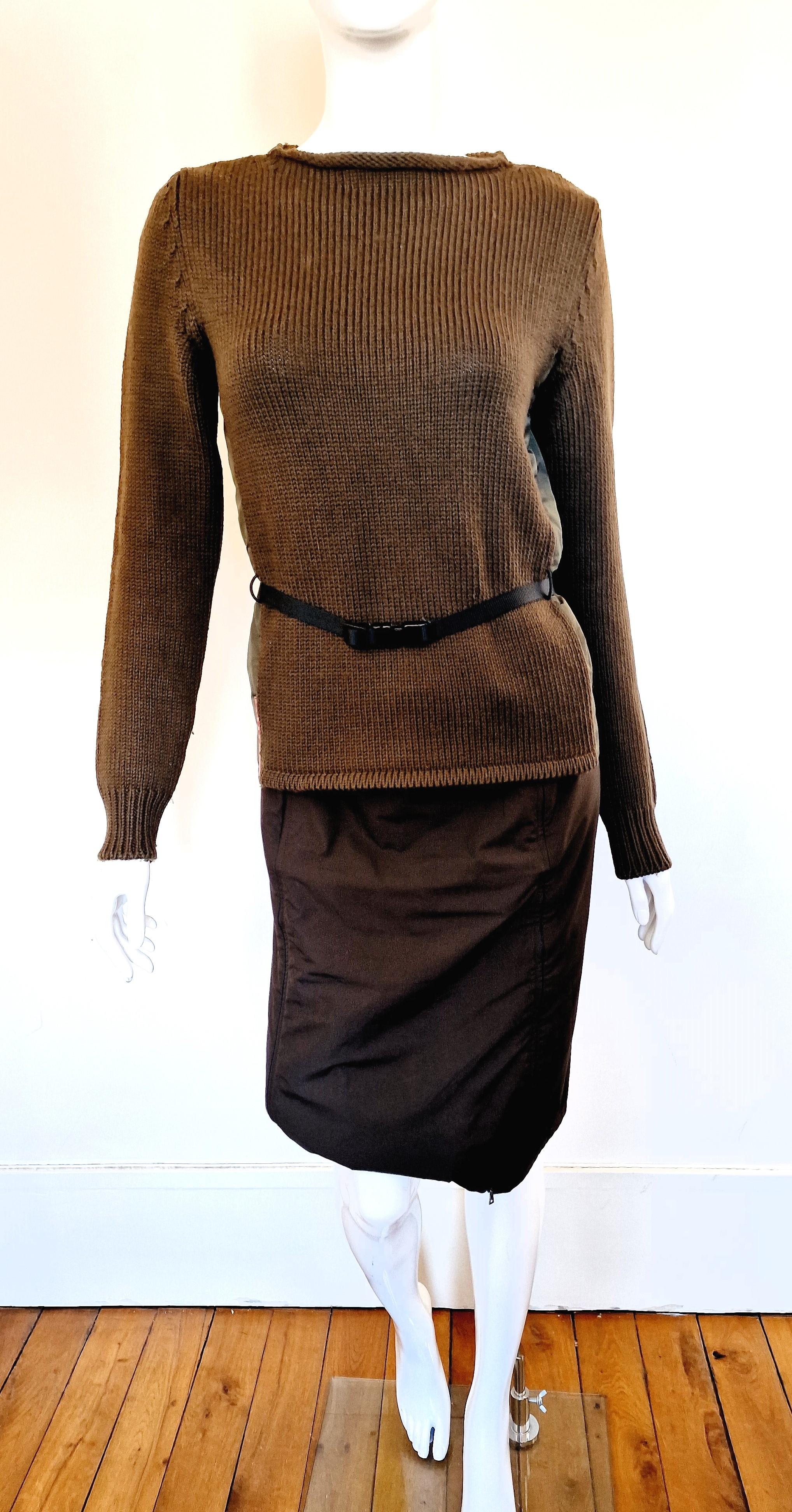 Tactical set by Prada!
Skirt + sweater!
Prada signatures on the sweater and the skirt as well. Red label.
The sweater has a belt with metal buckles. 
The skirt has 2 zippers, you can open the front :) 

EXCELLENT condition!
SIZE
Large.
Marked size: