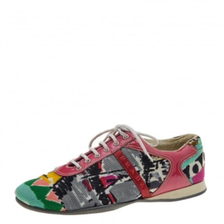 Coming in a classic low-top silhouette, these Prada Sport sneakers are a seamless combination of luxury, comfort, and style. They are made from fabric and patent leather in multiple shades. These sneakers are designed with logo details, laced-up