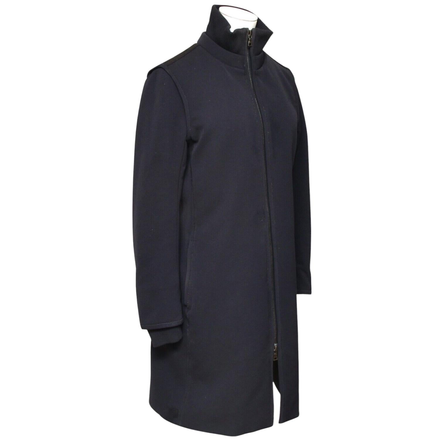 GUARANTEED AUTHENTIC PRADA SPORT NAVY COAT W/BLACK ACCENT

Design:
 • Basic coat to the knee in a navy color with black trim.
 • Stand-up collar.
 • Dual front vertical slip pockets.
 • Long sleeve.
 • Front two way zipper closure.

Material: 68%